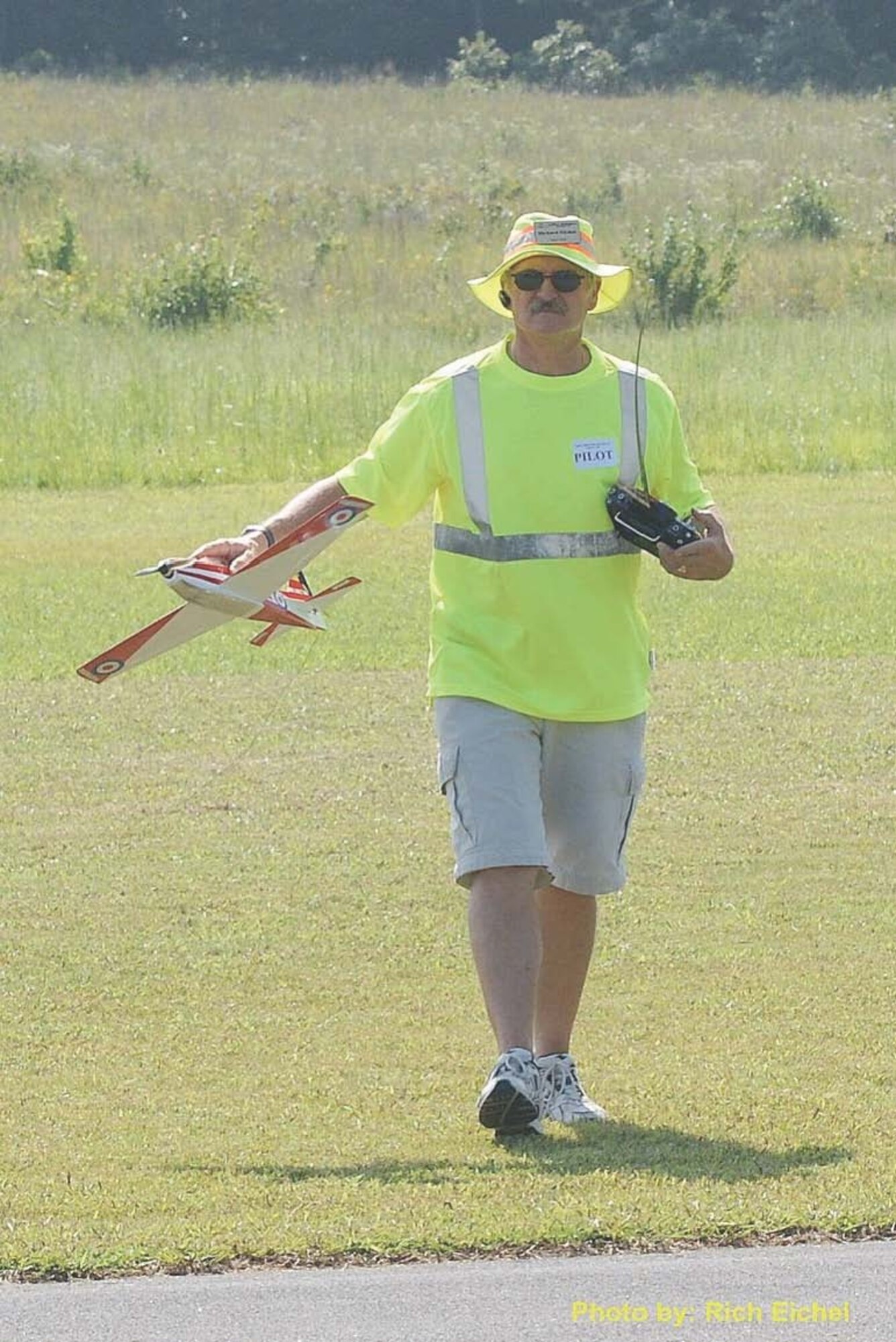 Rich Eichel, a member of the ATA safety staff, retrieves one of his planes during the Coffee Airfoilers Model Airplane Club’s annual electric-only flying event in 2010. He said the aircraft “bit the dust” on the next flight, a case of operator error. He said when flying a plane upside down, it is important to keep your orientation. In his case, he pulled back on the stick, which brought the aircraft down, rather than pushing the stick forward, which was now up. (Photo provided)