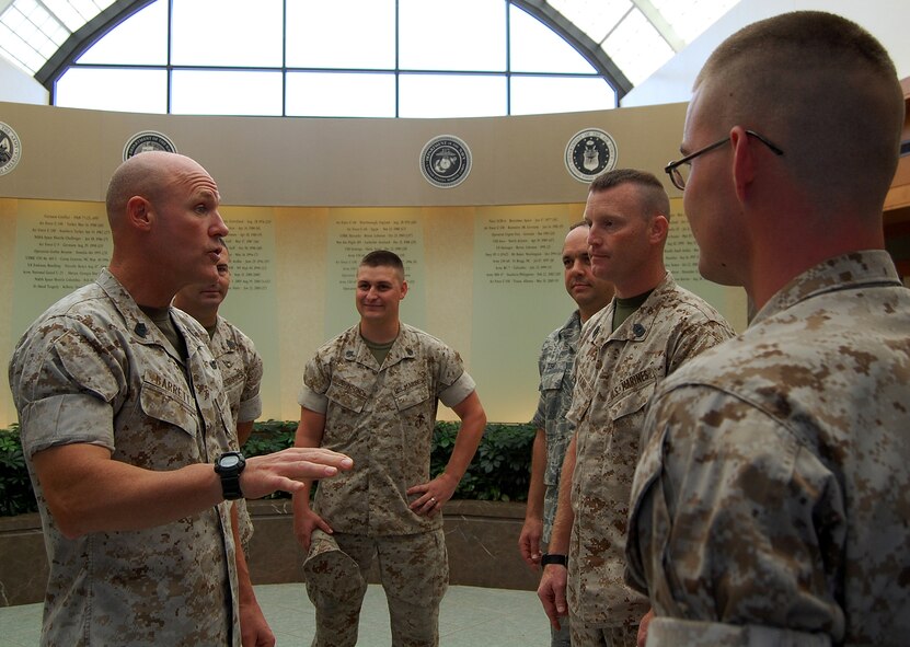 Sgt. Maj. of the Marine Corps Micheal Barrett meets with Marine liaisons July 14, 2011, at the Charles C. Carson Center for Mortuary Affairs along with personnel from the Joint Personal Effects Depot, Dover Air Force Base, Del. The senior enlisted leader for the U.S. Marine Corps toured the mortuary and Campus for Families of the Fallen to observe some of the processes involved in the care of the fallen, ranging from uniform preparation to the support provided for the families of fallen Marines and other servicemembers. (U.S. Air Force photo/Staff Sgt. Agustin Salazar)