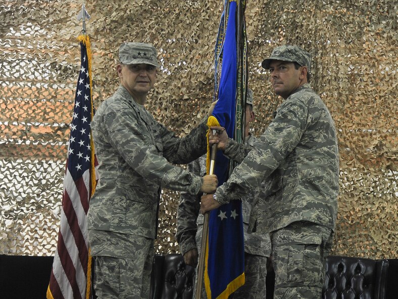 Maj. Gen. Stephen Hoog, 9th Air Force commander, hands the guidon to Col. Scott Kindsvater, incoming 93rd Air Ground Operations Wing commander, during a change of command ceremony at Moody Air Force Base Ga., July 15, 2011. Prior to assuming command of the wing, Kindsvater served as the executive assistant to the director of the Joint Staff in Washington, D.C. (U.S Air Force photo by Airman 1st Class Paul Francis/Released)