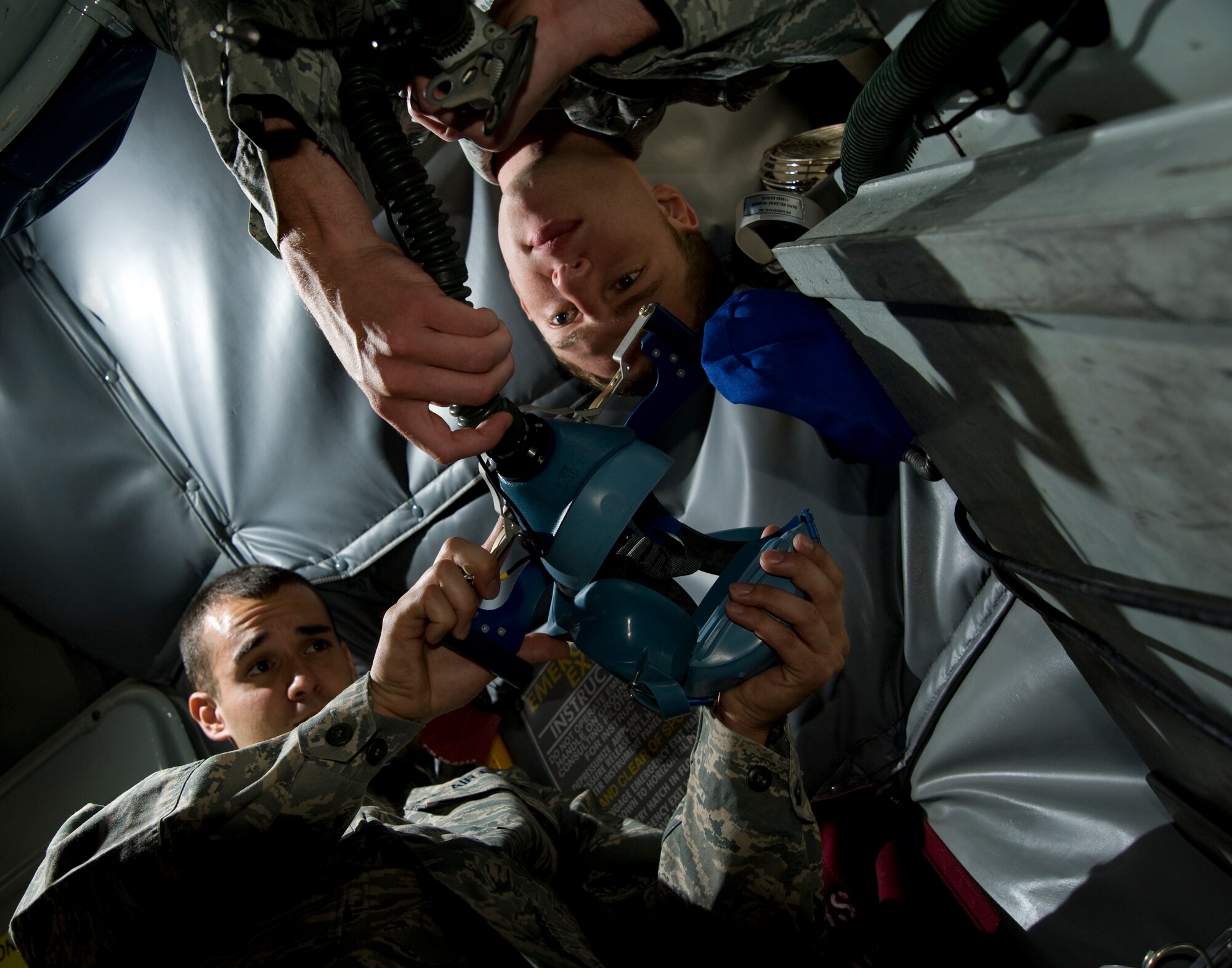 (Left to right) Staff Sgt. Jason Lanehart, 22nd Aircraft Maintenance Squadron RODEO Aerospace Maintenance journeyman, and Senior Airman Joseph Reese 22nd Aircraft Maintenance Squadron RODEO Aircraft Structural Maintenance journeyman, inspect a mask July 6, 2011, McConnell Air Force Base, Kan. Both Airmen are part of the 2011 RODEO team and are preparing their KC-135 Stratotanker to ensure the jet will be operational and able to perform during the competition. (U.S. Air Force photo/Airman 1st Class Armando A. Schwier-Morales)