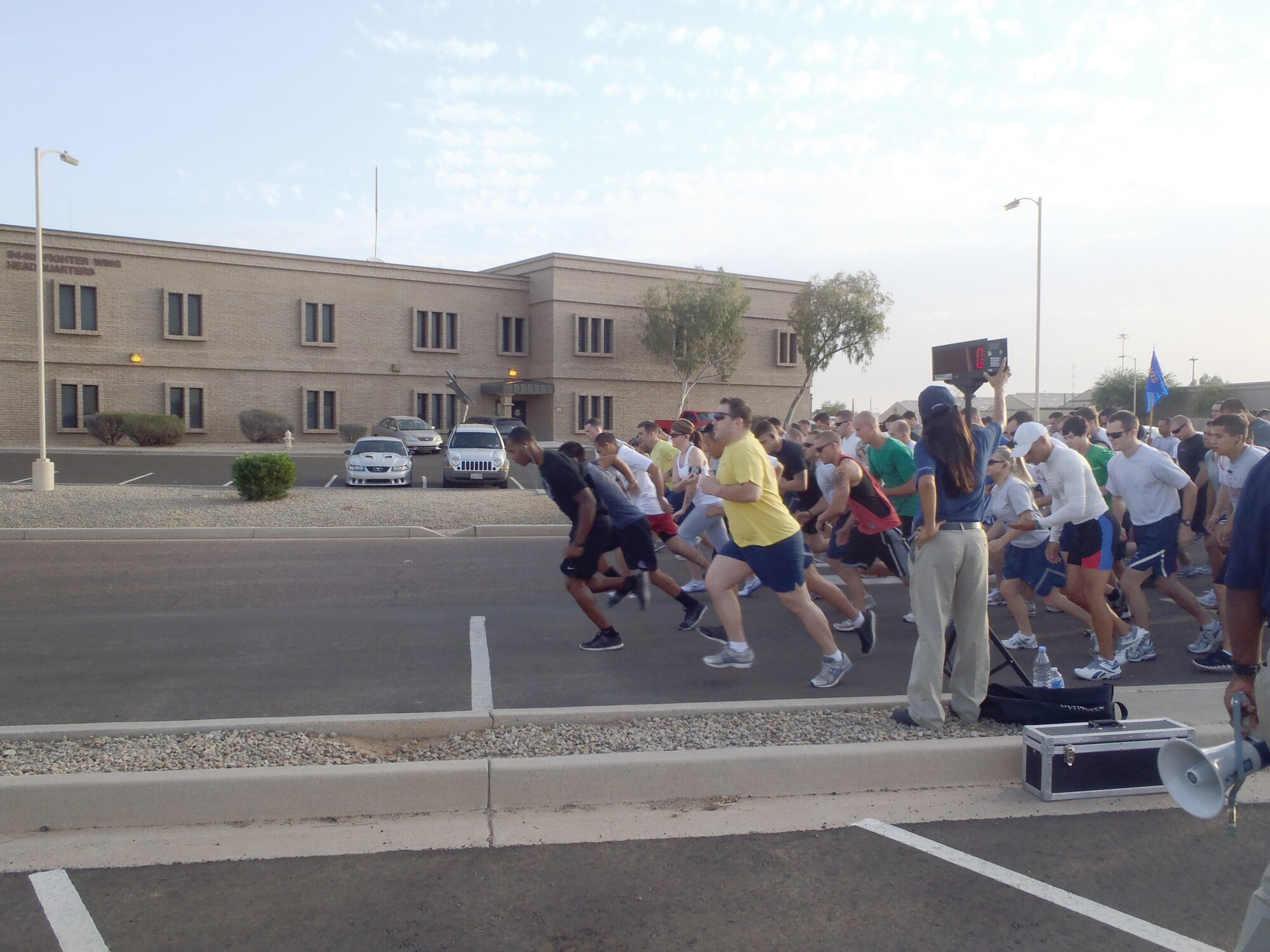 Luke Air Force Base Airmanand community members begin the Firecracker 5k fun run July 8 at Super Sabre St.on Luke Air Force Base, Ariz. The top three males and females received trophies.  (U.S. Air Force photo by Airman 1st Class David Owshianka)