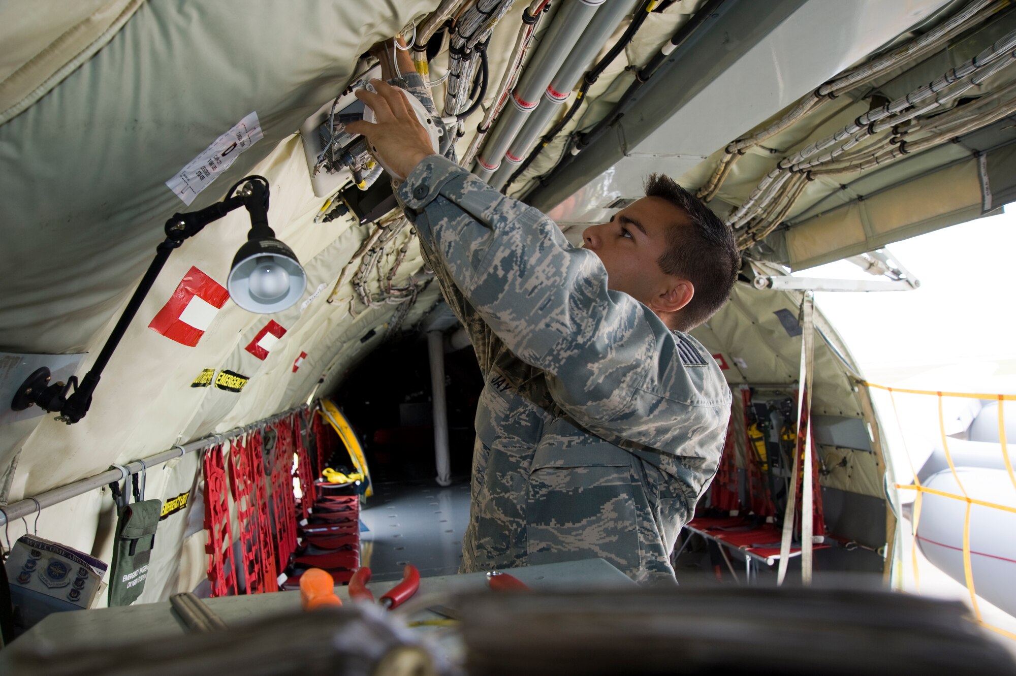 Tech. Sgt. Richard Jay, 22nd Aircraft Maintenance Squadron RODEO Electrical and Environmental craftsman, works on a light fixture in a KC-135 Stratotanker July 6, 2011, McConnell Air Force Base, Kan. Sergeant Jay and his other teammates have been preparing and beautifying the aircraft for more than two months. (U.S. Air Force photo/Airman 1st Class Armando A. Schwier-Morales)