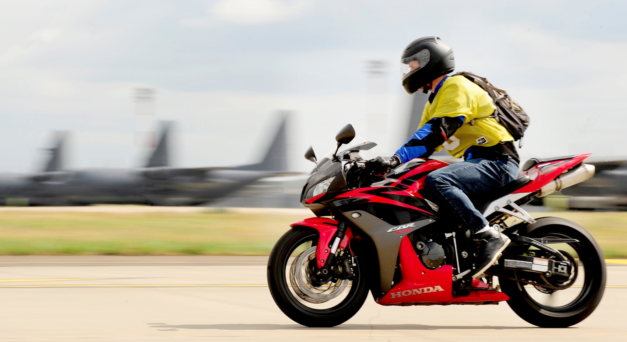 RAF MILDENHALL, England – A motorcyclist rides along part of the Motorcycle Cornering Confidence Course on the flightline here July 9, 2011. The course was designed to mimic the conditions of recent motorcycle safety mishaps in U.S. Air Forces in Europe to give students a controlled area to practice techniques. (U.S. Air Force photo/Senior Airman Ethan Morgan)