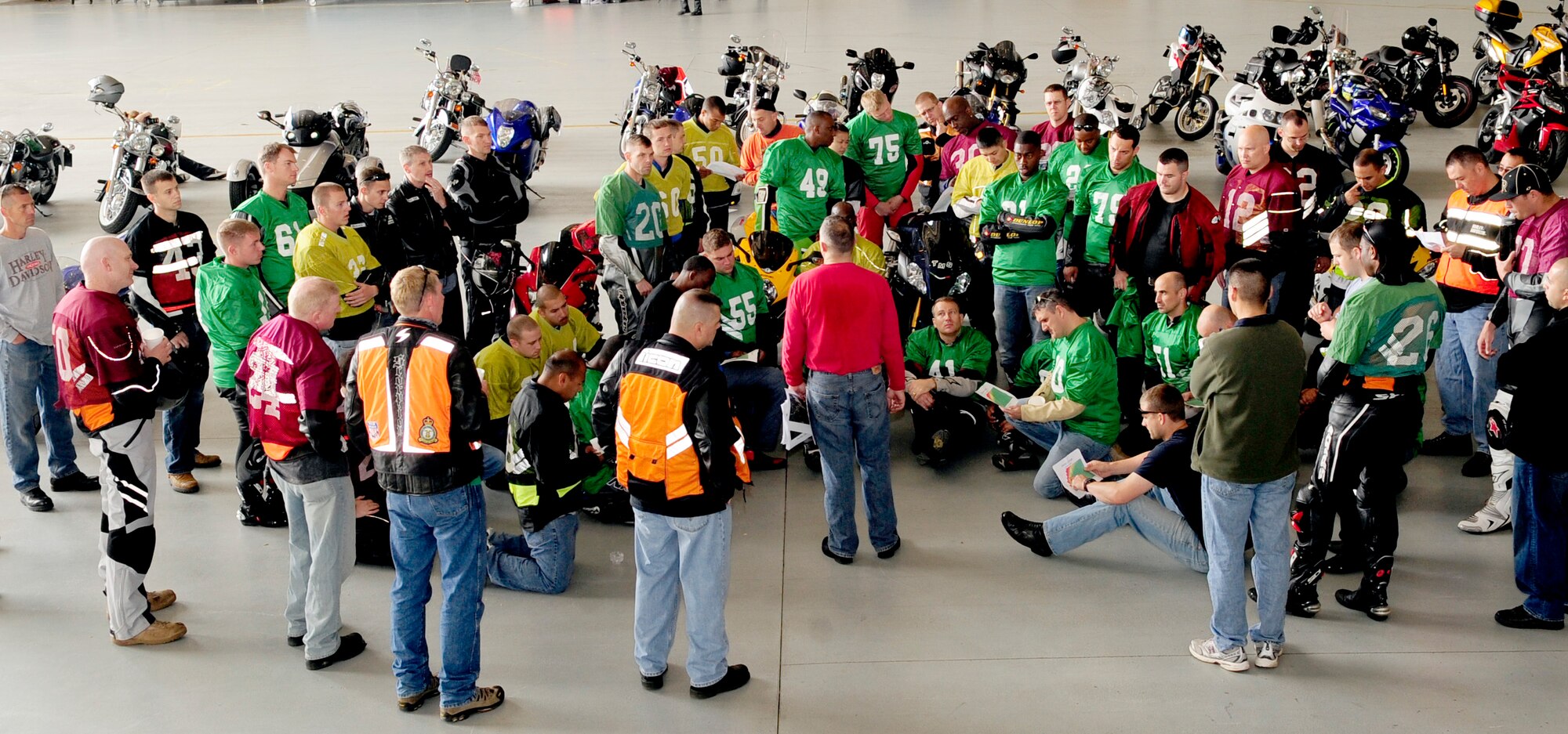 RAF MILDENHALL, England – Col. Michael Winters, 100th Air Refueling Wing vice commander and avid motorcyclist, briefs base motorcyclists on the layout and safety precautions of the Motorcycle Cornering Confidence Course held on the flightline here July 9, 2011. Nearly 60 motorcyclists from RAFs Mildenhall and Lakenheath revved their engines around course to gain experience in cornering and braking techniques. (U.S. Air Force photo/Senior Airman Ethan Morgan)