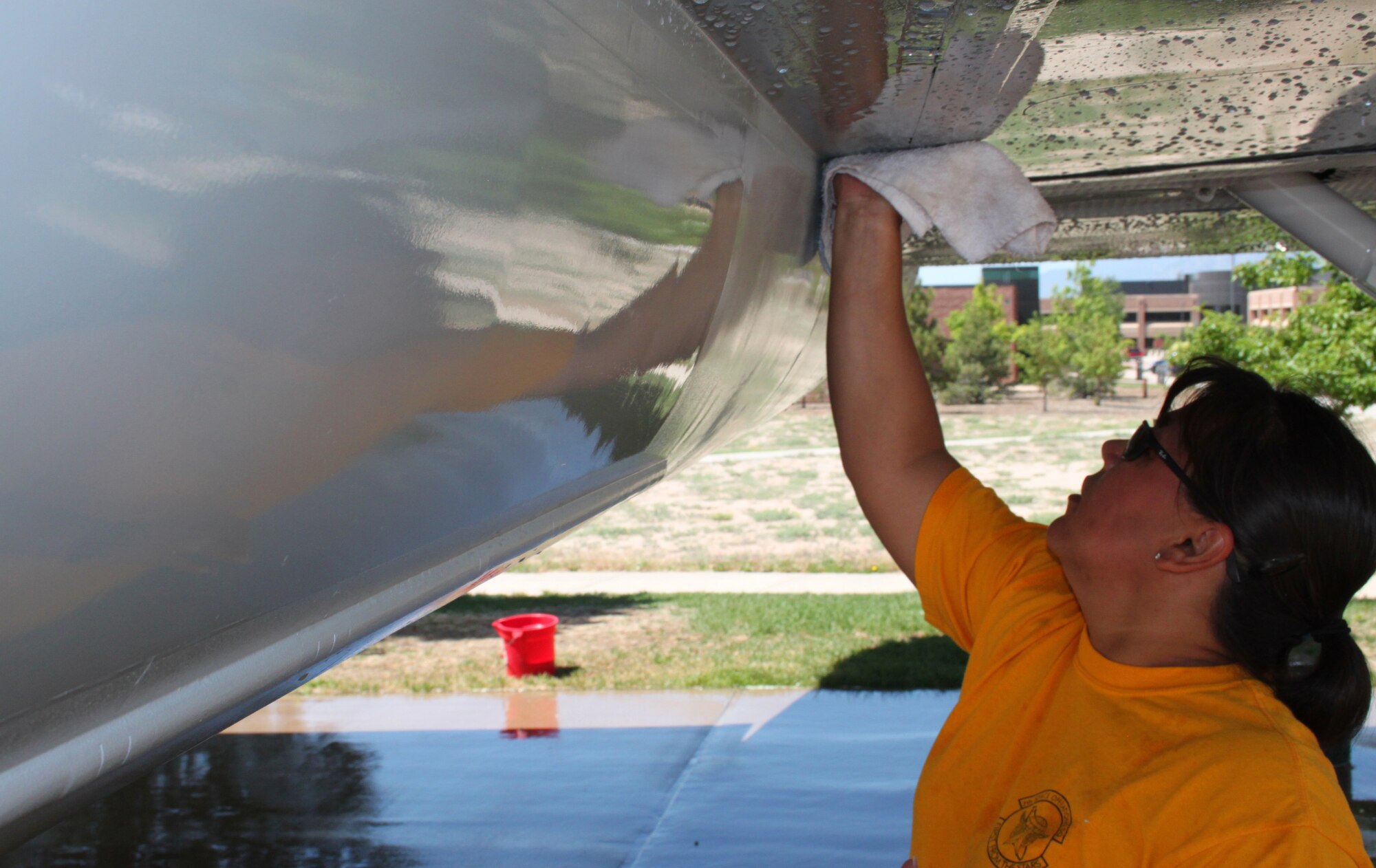 Master Sgt. Diana Keys was one of the seven 7 SOPS volunteers who cleaned up the F-106A “Delta Dart" on June 24 at the Peterson Air Force Base Museum. The museum has 17 aircraft, including three Army missiles on display. To help care for an aircraft, call the museum at 556-8314. (U.S. Air Force photo by Scott P. Farley)