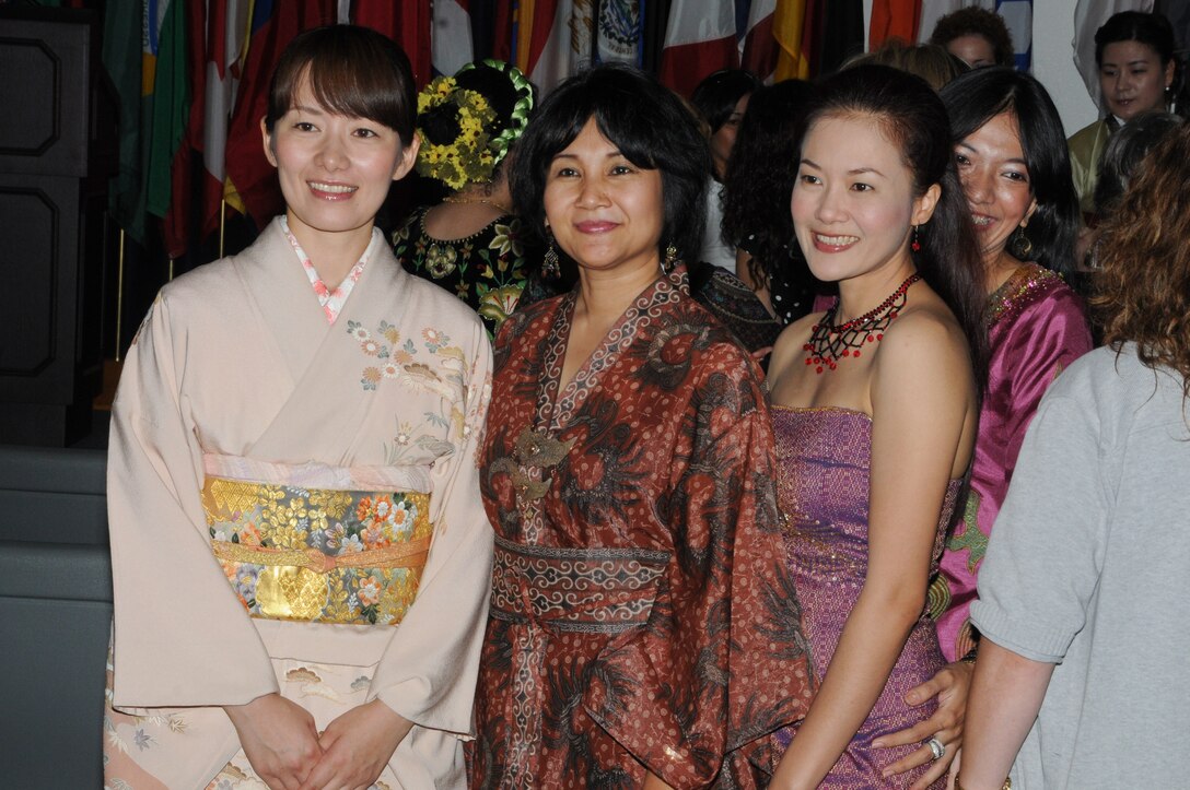 From left, Aya Kondo, Tantri Rosalanti and Kulrumpar Suvarnsinghacej enjoy a reception after the graduation ceremony. (Air Force photo/Wendy Simonds)