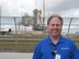Peter Montgomery poses for a photo Feb. 6, 2010, in fron of the space shuttle Endeavour before its launch for mission STS-130.