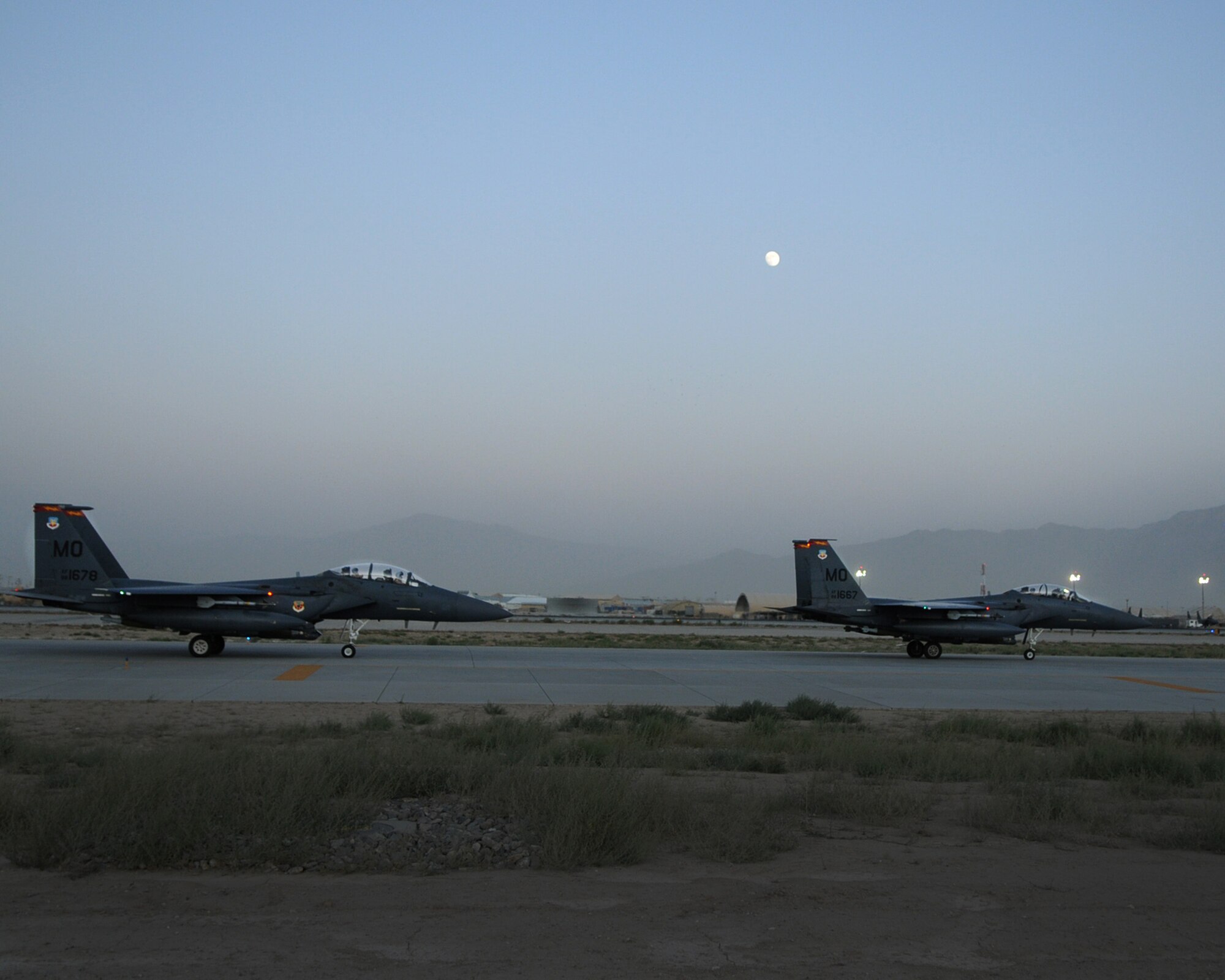 Two F-15E Strike Eagles from the 389th Expeditionary Fighter Squadron at Bagram Airfield prepare for takeoff in support of Operation Enduring Freedom July 13, 2011. (U.S. Air Force photo by Senior Airman Krista Rose)