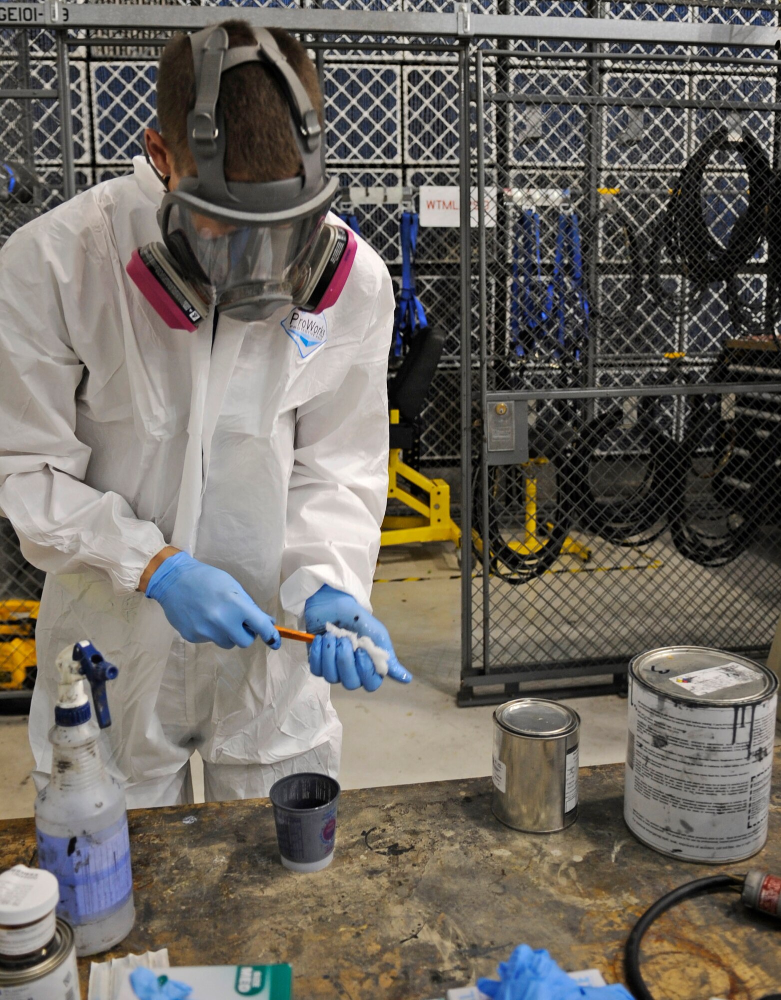 WHITEMAN AIR FORCE BASE, Mo. ? Senior Airman Kyle Miller, 509th Maintenance Squadron B-2 Spirit LO structural maintenance technician, mixes chemicals to produce the top coat for visual purposes here July 8. The LO section maintains the stealth capabilities of the B-2 by repairing the LO coating and internal and external structural hardware. (U.S. Air Force photo by Senior Airman Alexandra M. Boutte) (RELEASED)