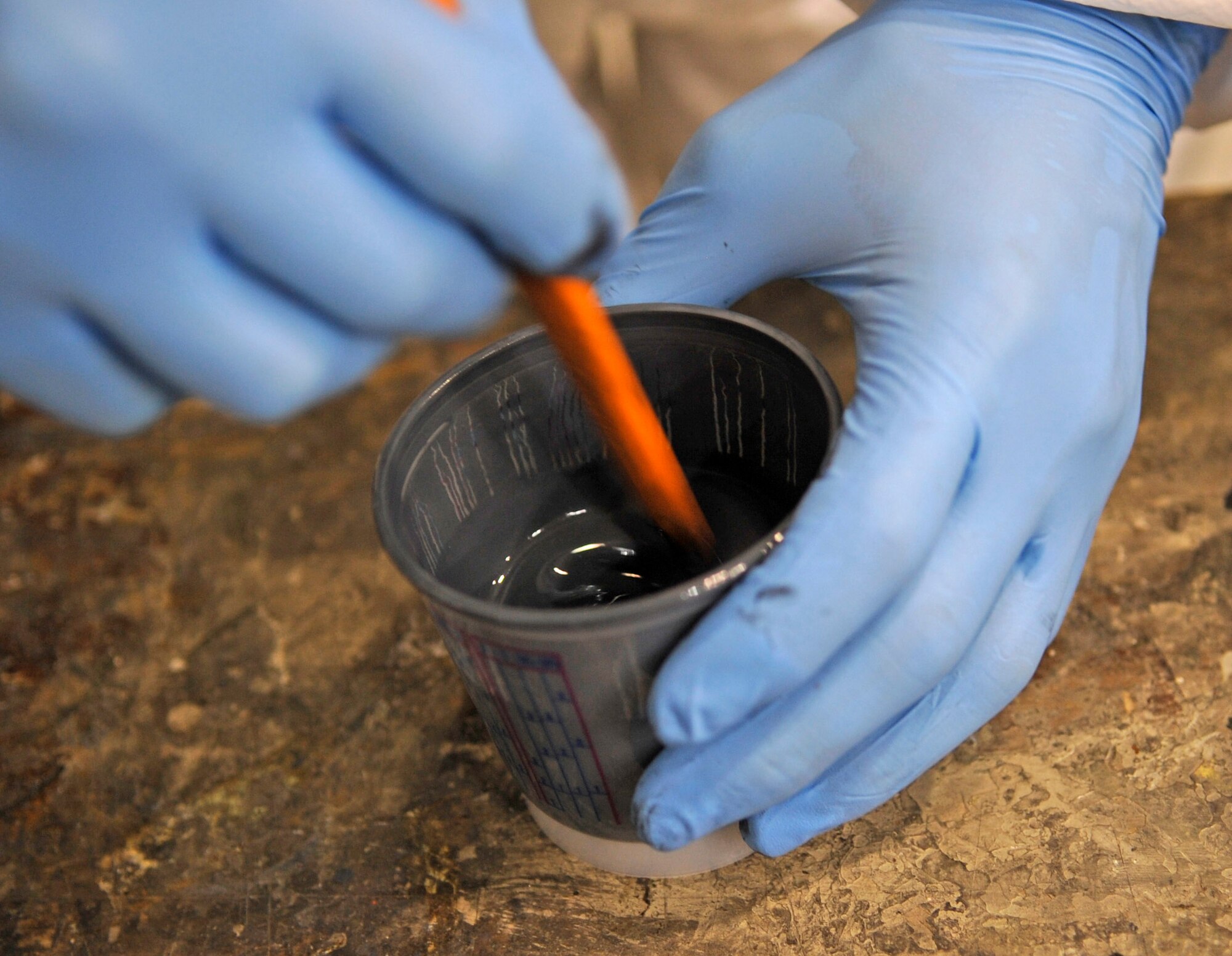 WHITEMAN AIR FORCE BASE, Mo. ? Senior Airman Kyle Miller, 509th Maintenance Squadron B-2 Spirit LO structural maintenance technician, mixes chemicals to produce the top coat of the B-2 for visual purposes here July 8. The LO section inspects and maintains structural equipment for advanced composites and sheet metal usage. (U.S. Air Force photo by Senior Airman Alexandra M. Boutte) (RELEASED)