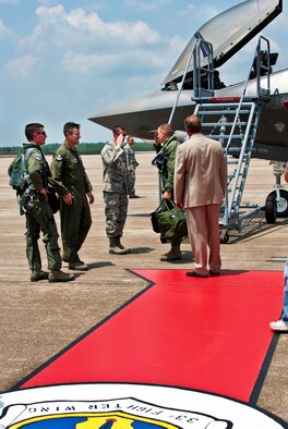 Tech. Sgt. Brian West, the crew chief for DoD's newest aircraft, the F-35 Lightning II joint strike fighter, salutes the pilot who brought it to its new home, Lt. Col. Eric Smith, of the 58th Fighter Squadron, July 14 at Eglin Air Force Base, Fla.  (U.S. Air Force photo/Samuel King Jr.) 


