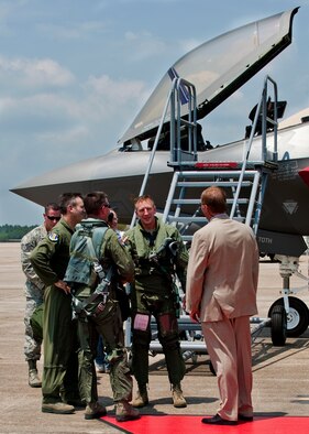 Lt. Col. Eric Smith, of the 58th Fighter Squadron, talks with his squadron and wing commanders after piloting the first F-35 Lightning II joint strike fighter to its new home at Eglin Air Force Base, Fla., July 14. (U.S. Air Force photo/Samuel King Jr.)


