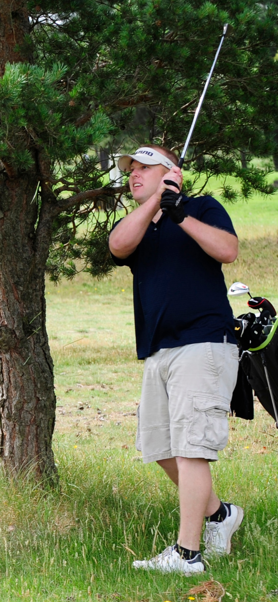 RAF MILDENHALL, England -- Brian Szarek, 100th Maintenance Squadron, plays a shot out of the rough during the RAF Mildenhall Intramural Golf play-offs at Breckland Pines Golf Club, RAF Lakenheath, July 12, 2011. The golf course is a 9-hole heathland type course with 18 different tee positions. (U.S. Air Force photo/Senior Airman Ethan Morgan) 