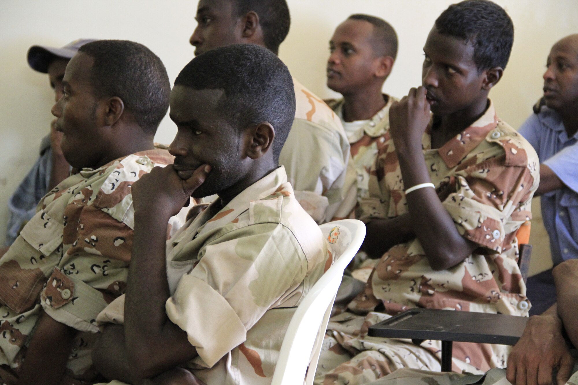 DJIBOUTI CITY, Djibouti - Djiboutian military medical students listen to a presentation on medical best practices, July 5. Members from Combined Joint Task Force-Horn of Africa partnered with the Djiboutian Ministry of Defense Health Services in a week-long seminar to share medical best practices. This information exchange between the two partner nations has occurred for nearly a decade. (U.S. Air Force photo by Capt. Jennifer Pearson)