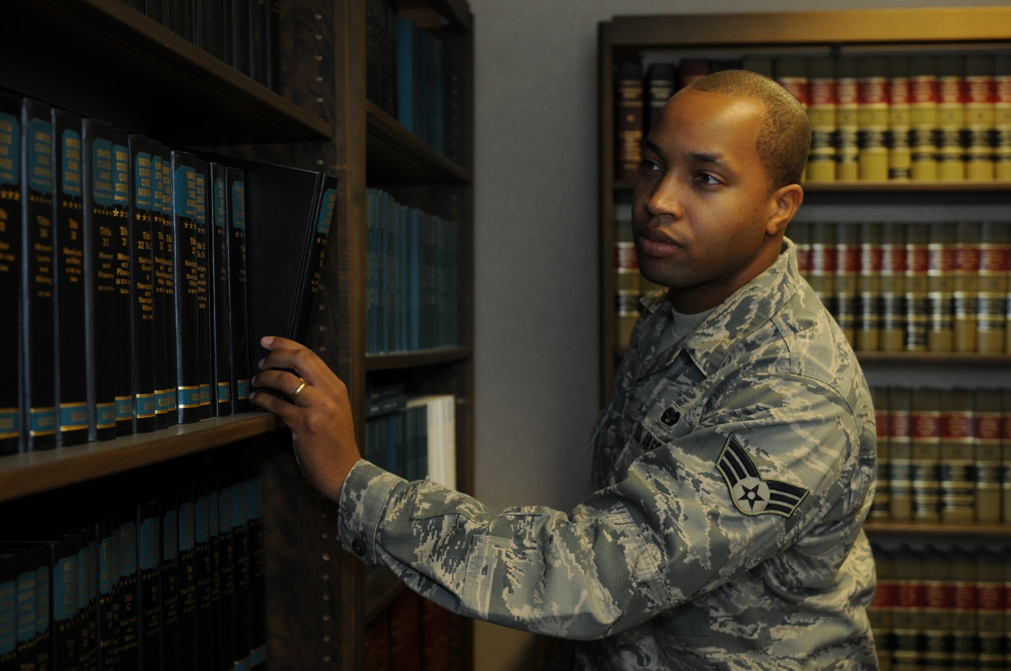 ROYAL AIR FORCE LAKENHEATH, England - Senior Airman Owen Seivright, 48th Judge Advocate military justice paralegal, searches the legal library on July 12, 2011. Seivright was nominated for a Liberty Spotlight because he displays the core value of 'Excellence in All We Do'. (U.S. Air Force photo/Airman Cory Payne)