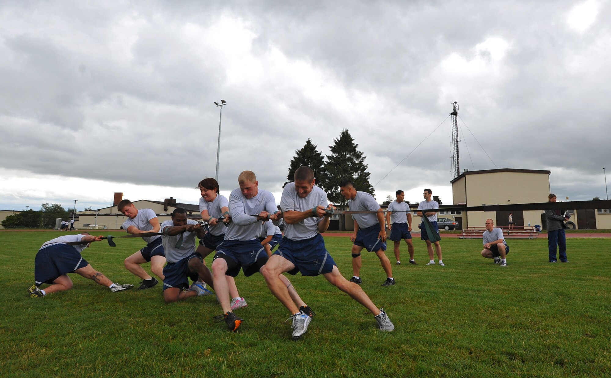 SPANGDAHLEM AIR BASE, Germany – Airmen assigned to the 52nd Equipment Maintenance Squadron compete in the Iron Flight tie-breaking tug-of-war event here July 13. The 52nd EMS ammo team won the Iron Flight competition after a tie-breaker tug-of-war event against the 52nd Force Support Squadron. (U.S Air Force photo/Airman 1st Class Dillon Davis)