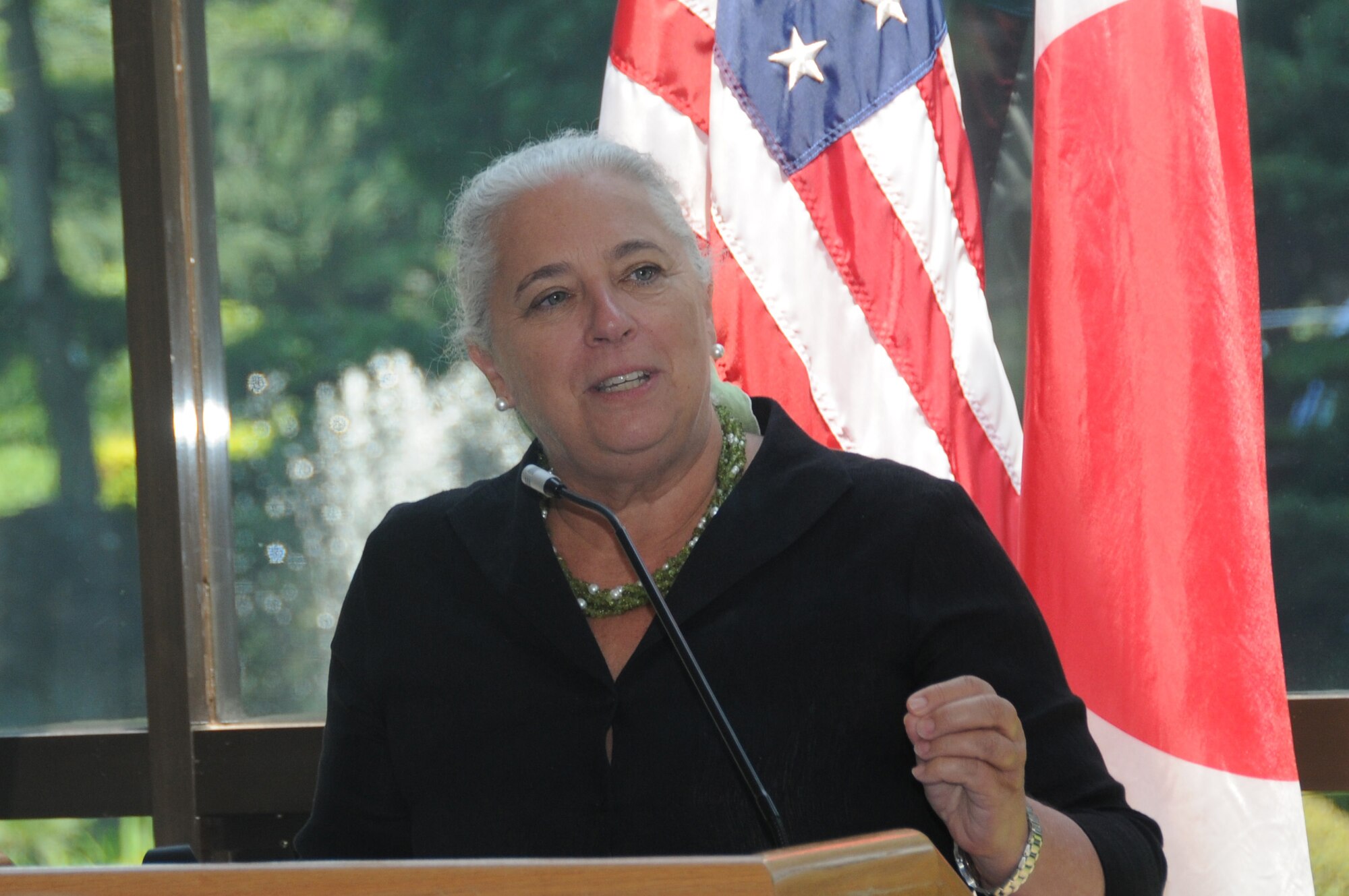 YOKOTA AIR BASE, Japan -- Renee Acosta, President and CEO for Global Impact, gives a brief speech about the Family Support and Youth Programs at the Combined Federal Campaign check presentation and unit awards ceremony at Yokota Air Base, Japan, July 11, 2011. The ceremony was originally scheduled for March but was postponed in the wake of the earthquake and tsunami that struck Japan March 11. (U.S. Air Force photo/Airman 1st Class Krystal M. Garrett)
