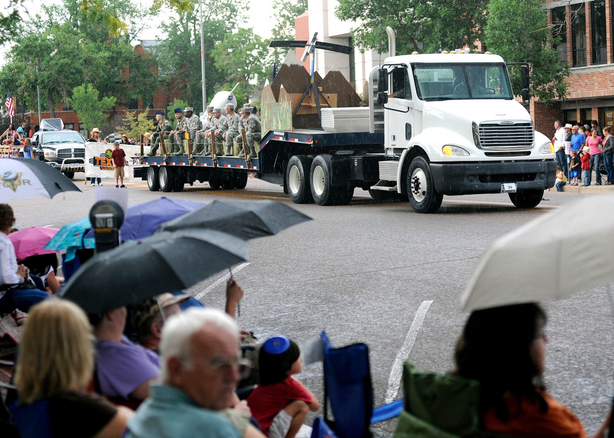 SCHRIEVER AIR FORCE BASE, Colo. --  Team Schriever members waved at the many spectators attending the 71st annual Pikes Peak or Bust Rodeo Days Kick-Off Parade in downtown Colorado Springs, July 12. The parade celebrates the western heritage, the Colorado Springs community, and the deep appreciation for our local service men and women. (U. S. Air Force Base photo/David Ahlschwede) 
