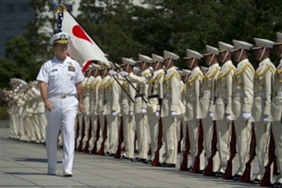 Chairman of the Joint Chiefs of Staff Adm. Mike Mullen reviews Japanese Self Defense Force troops during a welcoming ceremony at the Ministry of Defense in Tokyo, Japan, on July 15, 2011.  Mullen arrived in Japan after visiting China and Korea on a continuing Asian trip meeting with counterparts and leaders in the region.  