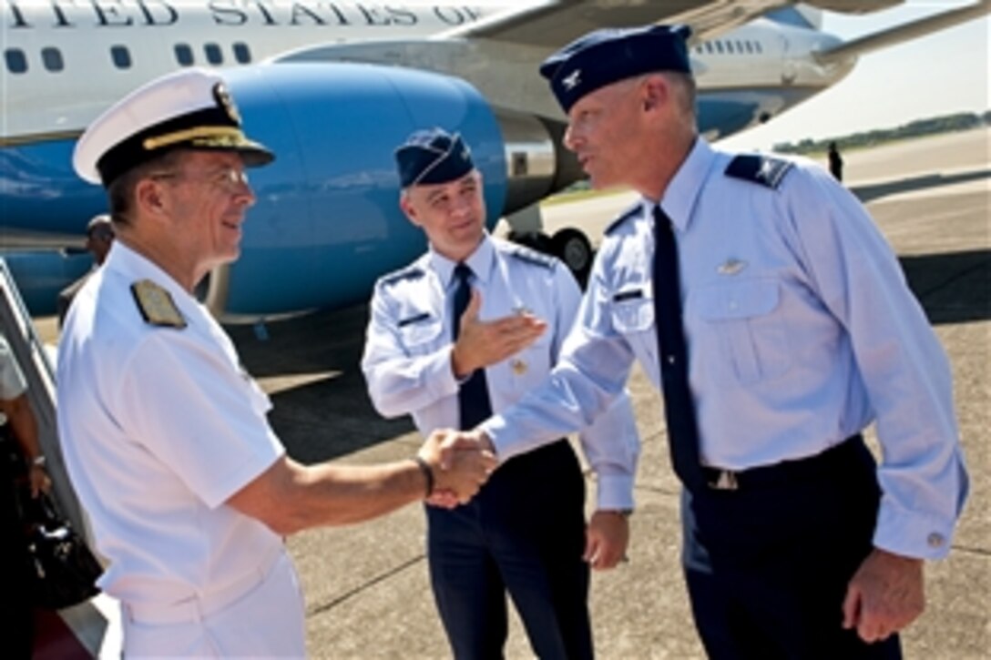 U.S. Air Force Lt. Gen. Burton M. Field, commander, U.S. Forces Japan, introduces U.S. Navy Adm. Mike Mullen, chairman of the Joint Chiefs of Staff, to U.S. Air Force Col. Paul E. "Otto" Feather, commander, 374th Airlift Wing, upon his arrival to Yokota Air Base, Japan on July 15, 2011. Mullen arrived in Japan after visiting China and Korea on a continuing Asian trip to meet with counterparts and leaders.