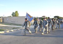 Staff Sgt. Luis Lopez, 902nd Security Forces Squadron, leads Joint Base San Antonio Airmen out of Lackland at the beginning of the “Ruck March to Remember.” The JBSA team will transfer the Defensor Fortis guidon to security forces Airmen from Barksdale Air Force Base, La., Saturday in La Grange for the next leg of the 2,181-mile march to Ground Zero. (U.S. Air Force photo/Alan Boedeker)