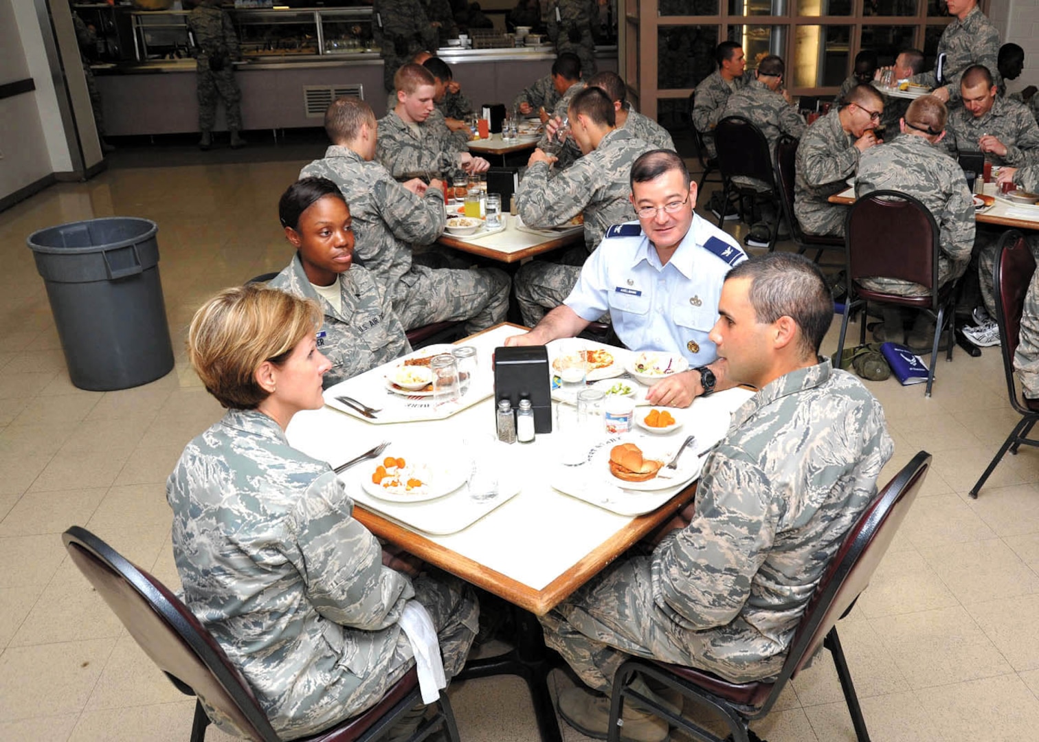 Colonel Axelbank, top, and Maj. Gen. Judith A. Fedder, director of logistics, deputy chief of staff for logistics, Installations and Mission Support, Headquarters U.S. Air Force, Washington, D.C., left, have lunch with basic trainees Erik Lopez and Jasmine Tucker at the 326th Training Squadron dining facility. (U.S. Air Force photo/Alan Boedeker)