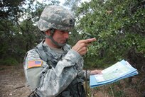 Army Staff Sgt. Adam Beitz, of the 717th Military Intelligence Battalion, checks coordinates during the land navigation segment of the 470th Military Intelligence Brigade’s Noncommissioned Officer of the Year competition June 1 at Camp Bullis. (U.S. Army photo/Gregory Ripps)