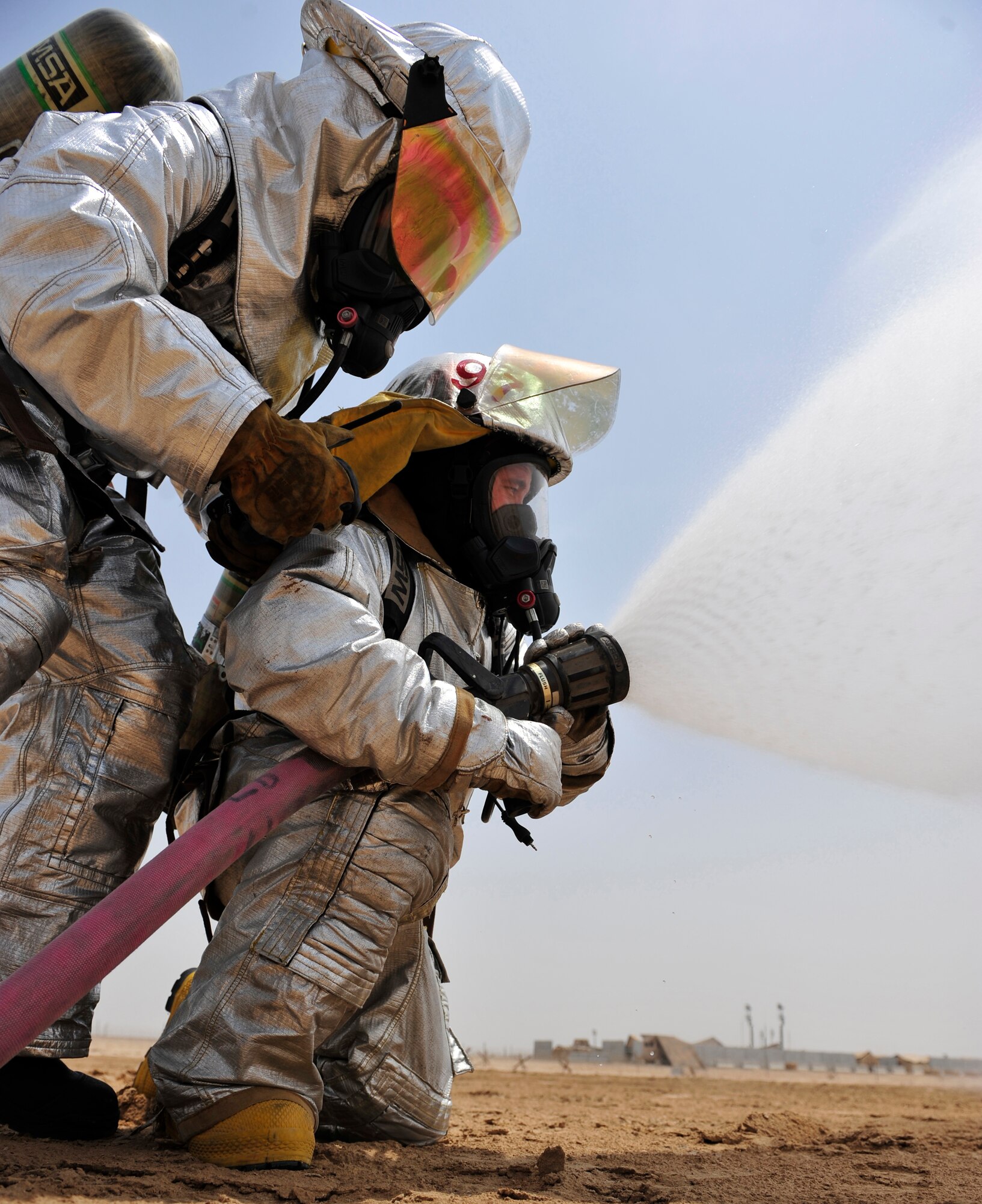 Airmen from the fire department part of the 380th Civil Engineer Squadron participated in a joint training exercise alongside the 3rd Battalion, 4th Air Defense Artillery Regiment, July 15, 2011, to learn how to effectively work together during an emergency situation. (U.S. Air Force photo/Staff Sgt. Patrick Mitchell)