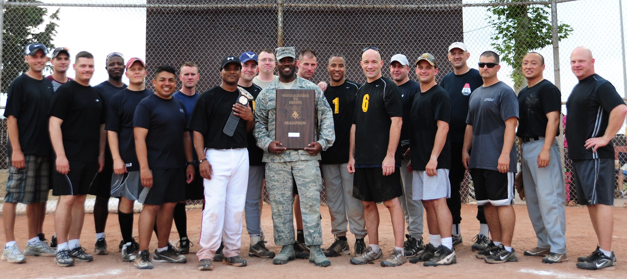 Chiefs, first sergeants and other senior enlisted members pose for photo as a team during the annual Chiefs vs. Eagles game July 15, 2011, at Incirlik Air Base, Turkey. The Chiefs came out victorious over the Eagles with a 14-8 win. (U.S. Air Force photo by Senior Airman Anthony Sanchelli/Released)