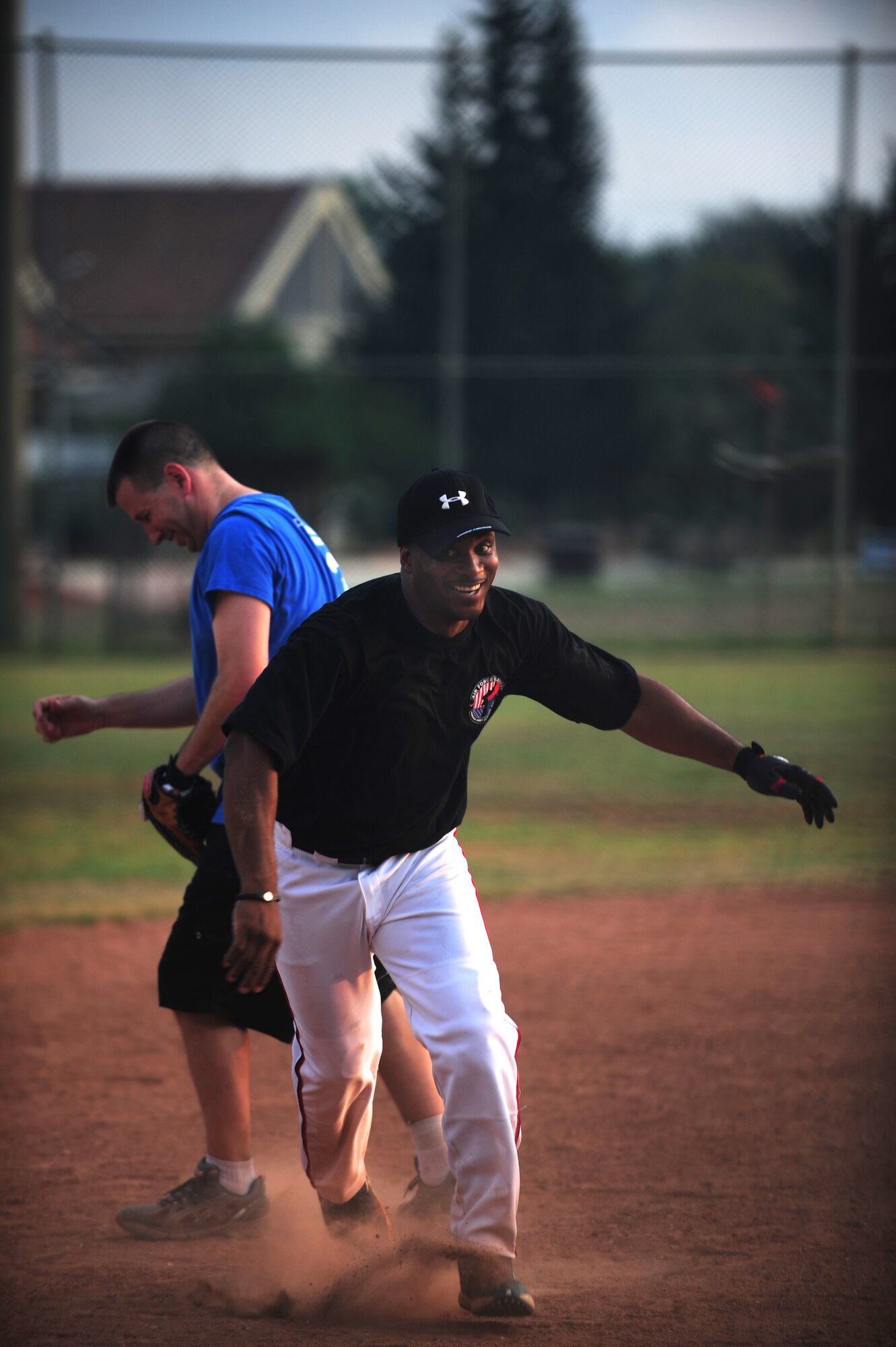 Roderick Dycus, 39th Mission Support Group superintendent, sprints to third base during the annual Chiefs vs. Eagles game July 15, 2011, at Incirlik Air Base, Turkey. The Chiefs came out victorious over the Eagles with a 14-8 win. (U.S. Air Force photo by Senior Airman Anthony Sanchelli/Released)

