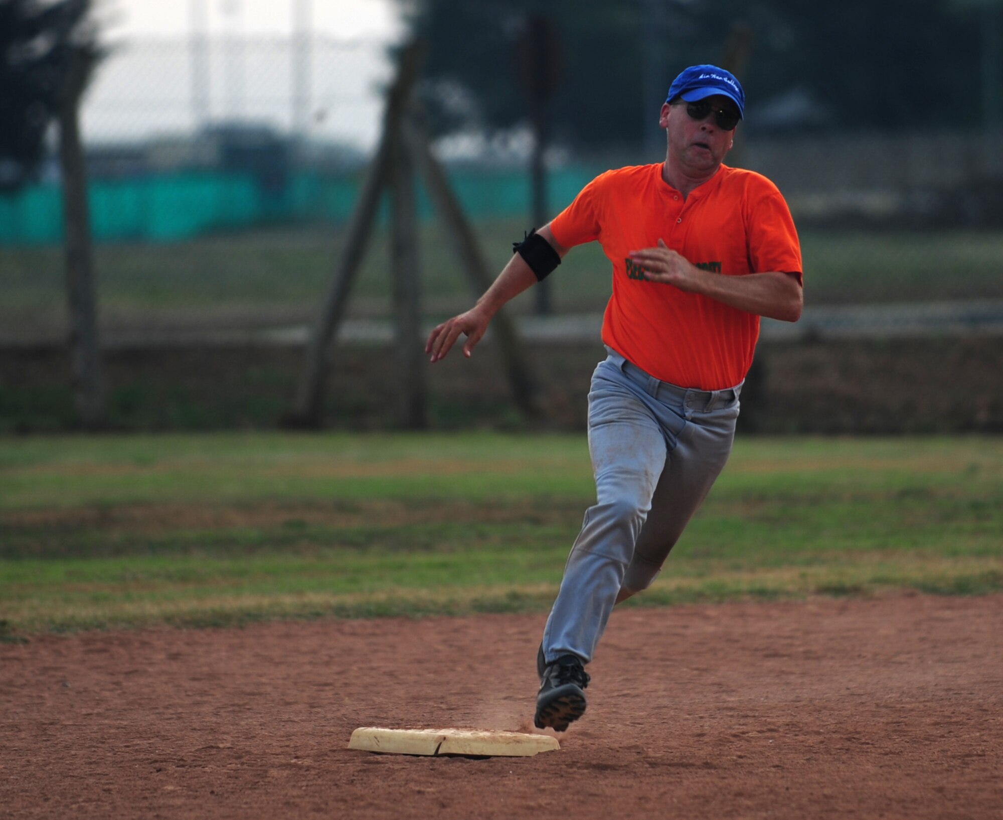 Anthony Butts, 39th Air Base Wing vice commander, rounds second base as he runs to third during the annual Chiefs vs. Eagles game July 15, 2011, at Incirlik Air Base, Turkey. The Chiefs came out victorious over the Eagles with a 14-8 win. (U.S. Air Force photo by Senior Airman Anthony Sanchelli/Released)
