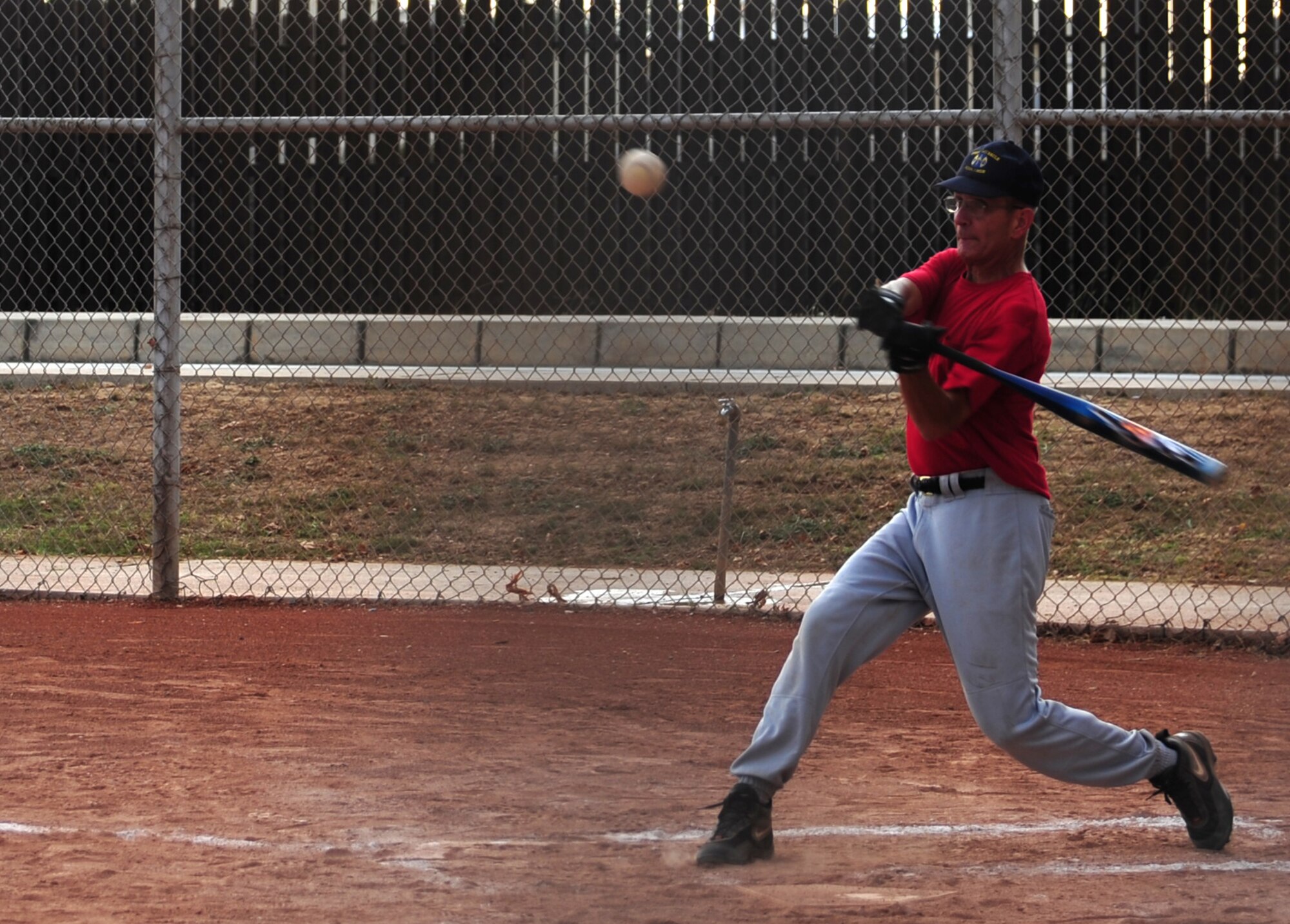Scott Rummage, 39th Air Base Wing chaplain, swings for the Eagle's team during the annual Chiefs vs. Eagles game July 15, 2011, at Incirlik Air Base, Turkey. The Chiefs came out victorious over the Eagles with a 14-8 win. (U.S. Air Force photo by Senior Airman Anthony Sanchelli/Released)

