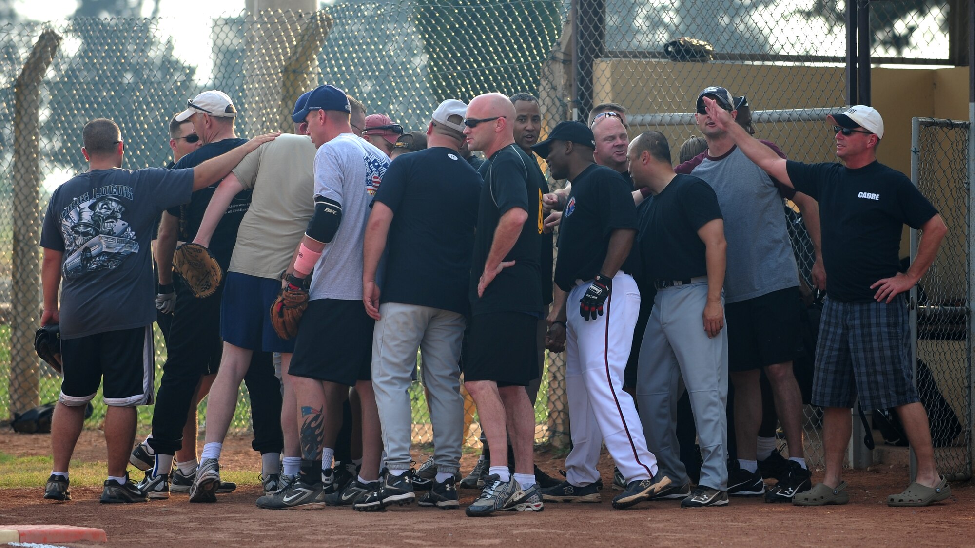 Chiefs, first sergeants and other senior enlisted members huddle together before the annual Chiefs vs. Eagles game July 15, 2011, at Incirlik Air Base, Turkey. The Chiefs came out victorious over the Eagles with a 14-8 win. (U.S. Air Force photo by Senior Airman Anthony Sanchelli/Released)
