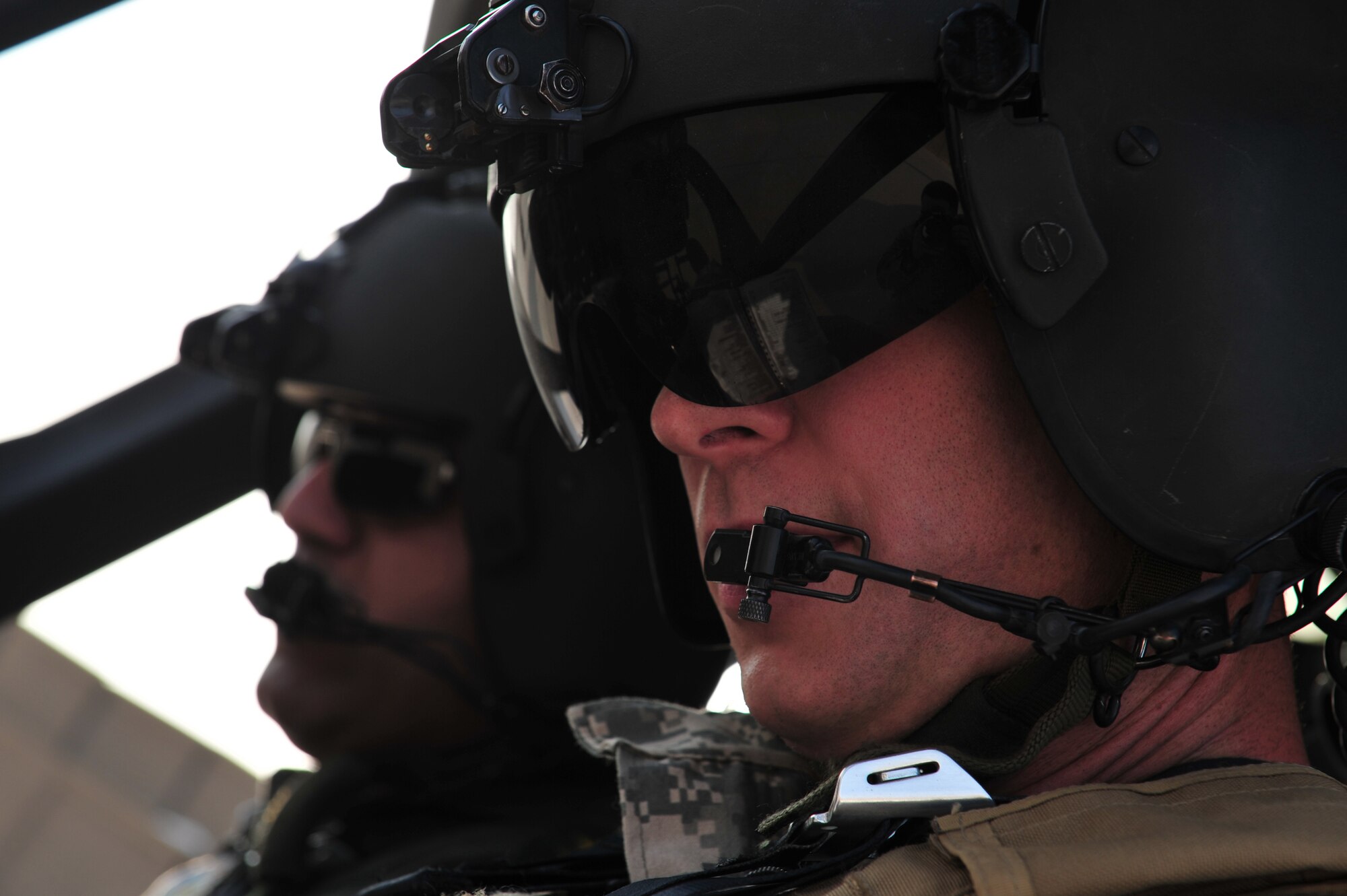 U.S. Army Maj. Kevin Ferner, 721st Air Expeditionary Advisory Squadron, and Bell 407 helicopter instructor pilot assists an Iraqi Army Aviation Command, Squadron 21 pilot prepare for takeoff prior to a training flight, at Taji Air Base, Iraq, July 12, 2011.  The 721st AEAS trains, advises and assists Iraqi pilots and maintenance personnel, focusing on sustainability, reliability and interoperability. (U.S. Air Force photo/Tech. Sgt. Josef E. Cole III)


