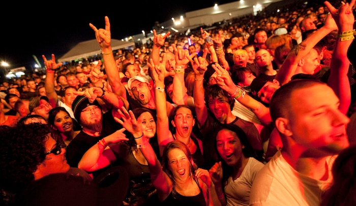 Concertgoers scream in eager anticipation of rock band Puddle of Mudd taking the stage for their concert during BayFest 2011 on Marine Corps Base Hawaii, July 16, 2011. Celebrating its 22nd year as Hawaii’s largest summer music festival, the three-day event — sponsored by Marine Corps Community Services — opened the base’s gates to the local community, featuring concerts by Cecilio and Kapono, Hoobastank, Puddle of Mudd and Joe Nichols, in addition to contests, carnival rides, food booths and military static displays.
