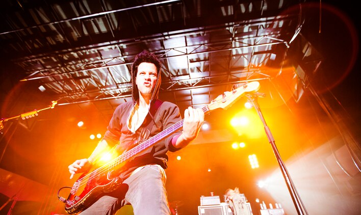 Puddle of Mudd guitarist Doug Ardito slams a face-melting guitar riff during the rock band’s performance at BayFest 2011 on Marine Corps Base Hawaii, July 16, 2011. Celebrating its 22nd year as Hawaii’s largest summer music festival, the three-day event — sponsored by Marine Corps Community Services — opened the base’s gates to the local community, featuring concerts by Cecilio and Kapono, Hoobastank, Puddle of Mudd and Joe Nichols, in addition to contests, carnival rides, food booths and military static displays.