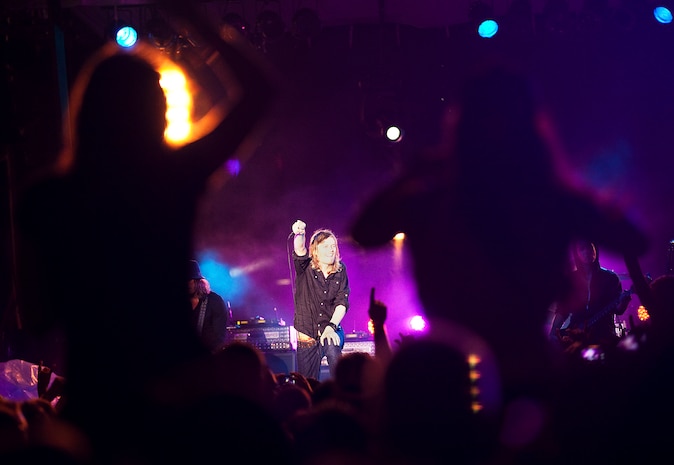 Puddle of Mudd frontman Wes Scantlin asks the crowd for more volume during the rock band’s performance at BayFest 2011 on Marine Corps Base Hawaii, July 16, 2011. Celebrating its 22nd year as Hawaii’s largest summer music festival, the three-day event — sponsored by Marine Corps Community Services — opened the base’s gates to the local community, featuring concerts by Cecilio and Kapono, Hoobastank, Puddle of Mudd and Joe Nichols, in addition to contests, carnival rides, food booths and military static displays.