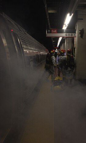 Marines from Initial Response Force B, Chemical Biological Incident Response Force, pull victims out of Pennsylvania Station during a joint operation drill with the New York City Fire Department in the early hours of 16 July. The drill was the culmination of the Marine’s week-long training with FDNY. CBIRF and FDNY have trained together since July of 2000; Deputy Chief Raymond M. Downey, of FDNY’s Special Operations Command, helped CBIRF develop their technical rescue program before he later died on Sept. 11th in the World Trade Center towers. (released)