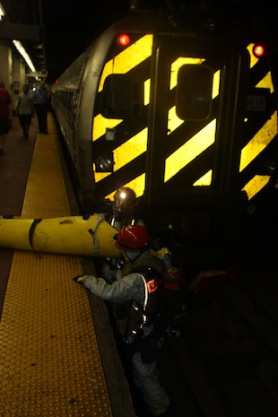 Marines from Extraction Platoon, Initial Response Force B pull victims out of the subways of Pennsylvania Station during a joint operation drill with the New York City Fire Department in the early hours of 16 July. The drill was the culmination of the Marine’s week-long training with FDNY. CBIRF and FDNY have worked together for more than 11 years; Deputy Chief Raymond M. Downey, of FDNY’s Special Operations Command, and a former Marine, helped CBIRF develop their technical rescue program before he later died on 9/11 in the World Trade Center towers. (released)