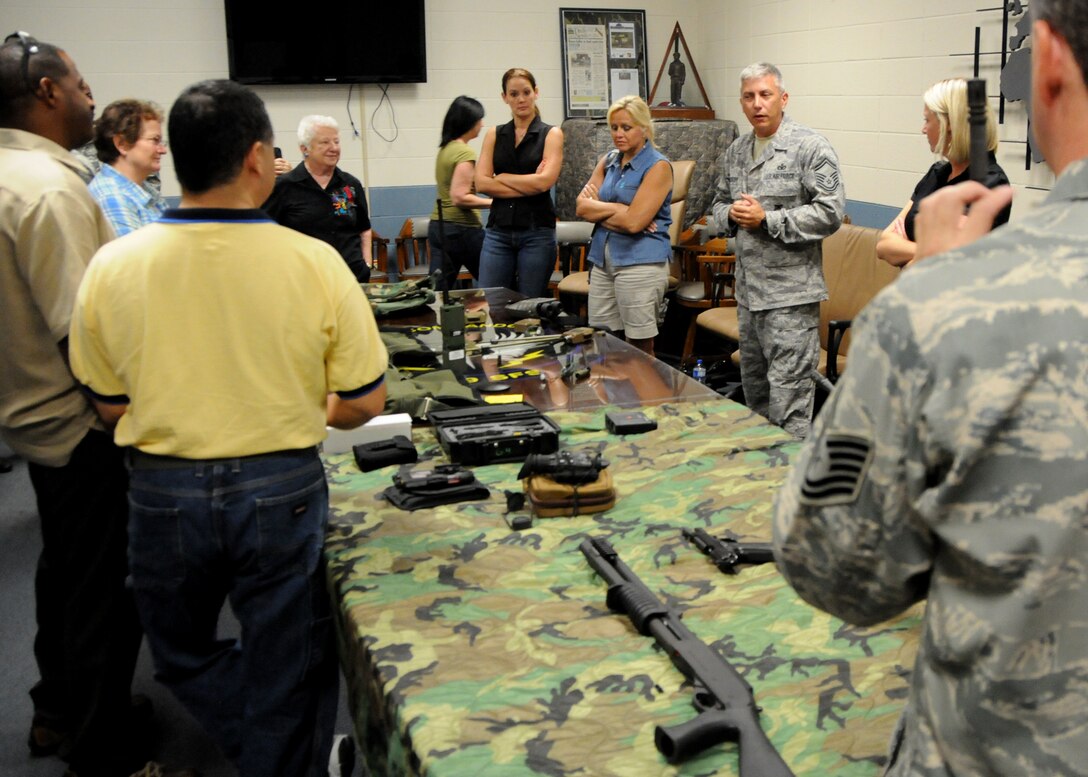 Air Force Reserve Senior Master Sgt. Ronald McCully of the 919th Security Forces Squadron briefs a group of visiting civilian employers about some of the unit's combat arms and equipment during a tour of Duke Field July 9.  Each year, reservists from the 919th Special Operations Wing are encouraged to invite their employers to Employer Appreciation Day, an event aimed at praising their support and informing and educating them on the vital roles their reservist "Citizen Commandos" play in national defense.  Employers received a mission briefing from the wing's commander, toured several squadron work centers and took a local area flight aboard one of the wing's MC-130E Combat Talon aircraft. (U.S. Air Force photo/Tech. Sgt. Cheryl Foster)