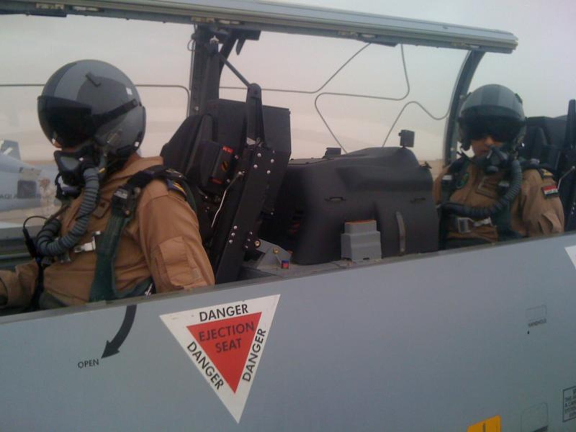 Iraqi Air Force Lt. Hassan Ali Al Saedi, Squadron 203, Tikrit Air Base, Iraq, (rear seat) prepares for a flight in a T-6 Texan III at Tikrit Air Base, Iraq. Hassan was selected as the IqAF’s first T-6 Texan III first assignment instructor pilot. (Courtesy photo) 