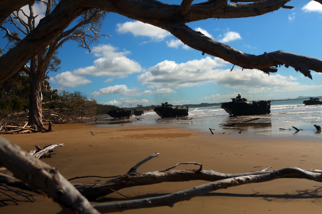 Amphibious Assault Vehicles with Company G, Battalion Landing Team 2nd Battalion, 7th Marines, 31st Marine Expeditionary Unit, land on Freshwater Beach during a mock amphibious assault rehearsal, July 18. TS11 is the largest joint military exercise undertaken by the Australian Defence Force. Around 14,000 U.S. and 9,000 Australian personnel will participate. TS11 provides an opportunity to conduct operations in a combined and joint environment that will increase both countries’ bilateral war-fighting capabilities to respond to crisis and to provide humanitarian assistance. The 31st MEU is the only continuously forward-deployed MEU and remains the nation’s force in readiness in the Asia-Pacific region.