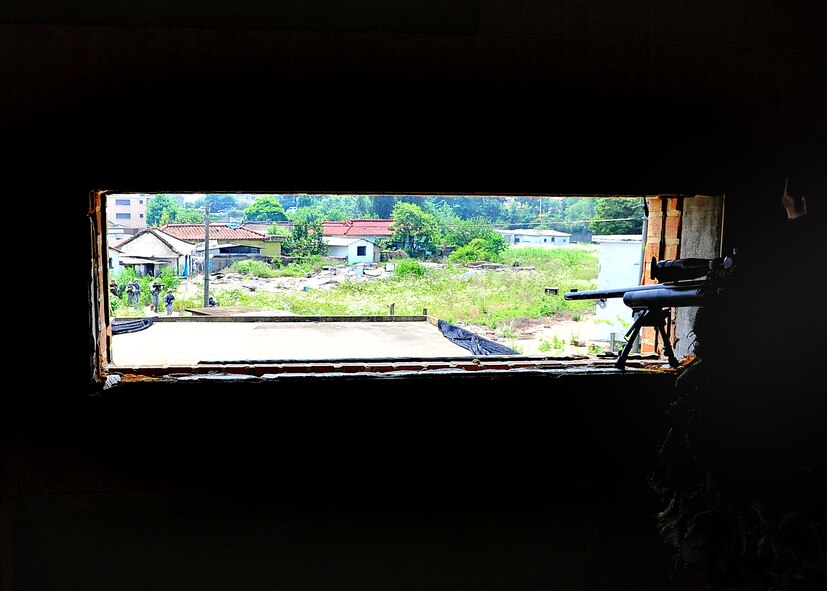 51st Security Forces Squadron and Republic of Korea Air Force members performed base defense operations training during the combat readiness course at Osan Air Base, June 26. During training, combined SF members' reacted to [simulated] hostile forces. Members were challenged with securing Base Alpha, executing troop movement maneuvers and communication tactics. Security Forces members are responsible for ensuring the safety of bases, weapons, property and personnel from hostile forces. (U.S Air Force Photo by/Staff Sgt. Daylena Gonzalez)