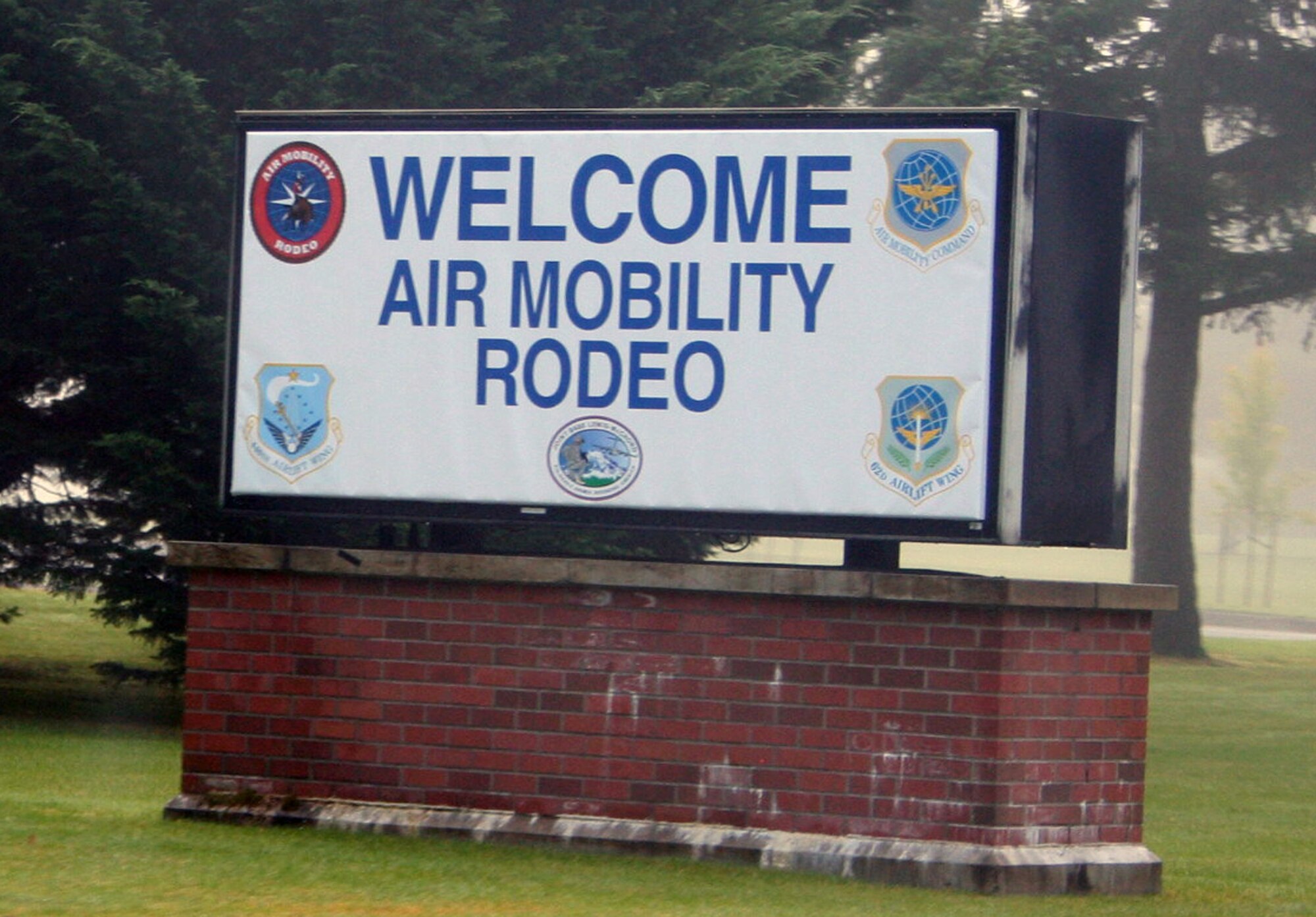 A sign welcomes staff members and participants for Air Mobility Rodeo 2011 at the entrance gate at Joint Base Lewis-McChord, Wash., on July 18, 2011. Air Mobility Rodeo is the U.S. Air Force's and Air Mobility Command's premier international combat skills and flying operations competition designed to develop and improve techniques, procedures, and interoperability, while optimizing international mobility partnerships and enhancing mobility operations. (U.S. Air Force Photo/Master Sgt. Scott T. Sturkol)