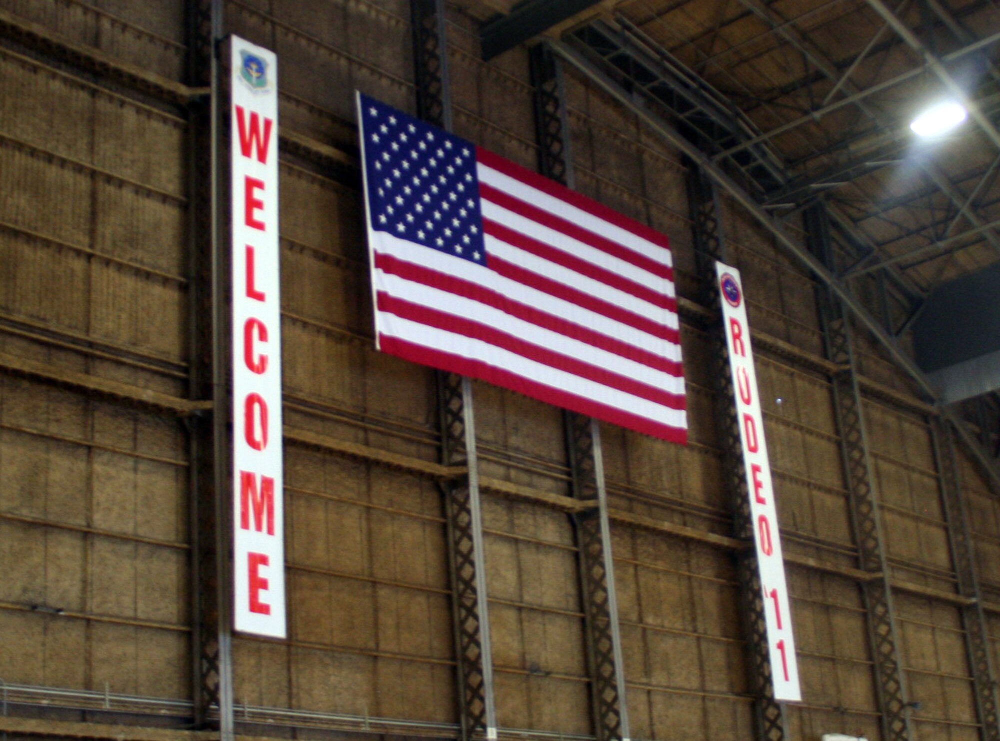 A sign welcomes staff members and participants for Air Mobility Rodeo 2011 inside a hangar at Joint Base Lewis-McChord, Wash., on July 17, 2011. Air Mobility Rodeo is the U.S. Air Force's and Air Mobility Command's premier international combat skills and flying operations competition designed to develop and improve techniques, procedures, and interoperability, while optimizing international mobility partnerships and enhancing mobility operations. (U.S. Air Force Photo/Master Sgt. Scott T. Sturkol)