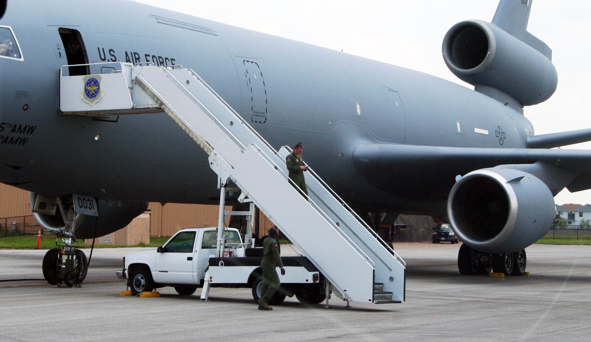 Aircrew Airmen from the 305th Air Mobility Wing of Joint Base McGuire-Dix-Lakehurst, N.J., prepare a KC-10 Extender for a mission at Scott Air Force Base, Ill., on July 17, 2011. The KC-10 flew staff members supporting Air Mobility Rodeo 2011 from Scott AFB to Joint Base Lewis-McChord, Wash. Air Mobility Rodeo is the U.S. Air Force's and Air Mobility Command's premier international combat skills and flying operations competition designed to develop and improve techniques, procedures and interoperability, while optimizing international mobility partnerships and enhancing mobility operations. (U.S. Air Force Photo/Master Sgt. Scott T. Sturkol)