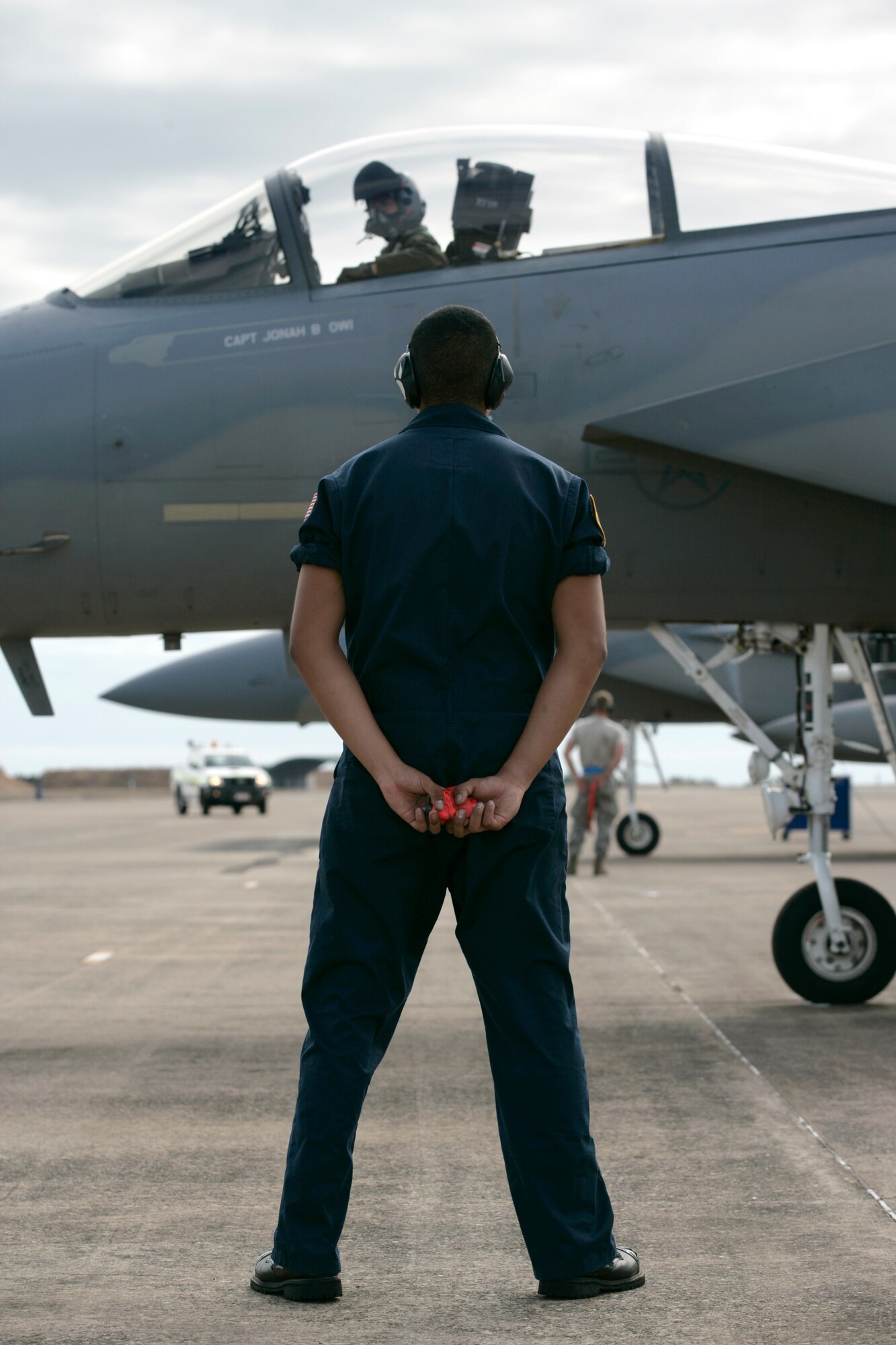 United States Air Force 18th Maintenance Squadron Crew Chief, Airman First Class Orlando Nastacio, waits for the F-15C Eagle to shutdown after a sortie in the buildup to Exercise Talisman.Mid Caption: RAAF Base Darwin is hosting six F-15C Eagle fighter jets from the United States Air Force?s 44th Fighter Squadron for Exercise Talisman Sabre 2011. The Eagles, based at Kadena Air Base in Okinawa, Japan, are being supported by technicians from the 18th Maintenance Squadron, also from Kadena. These aircraft are conducting missions over training areas in the Northern Territory with a mix of United States Air Force, Navy, and Royal Australian Air Force aircraft.