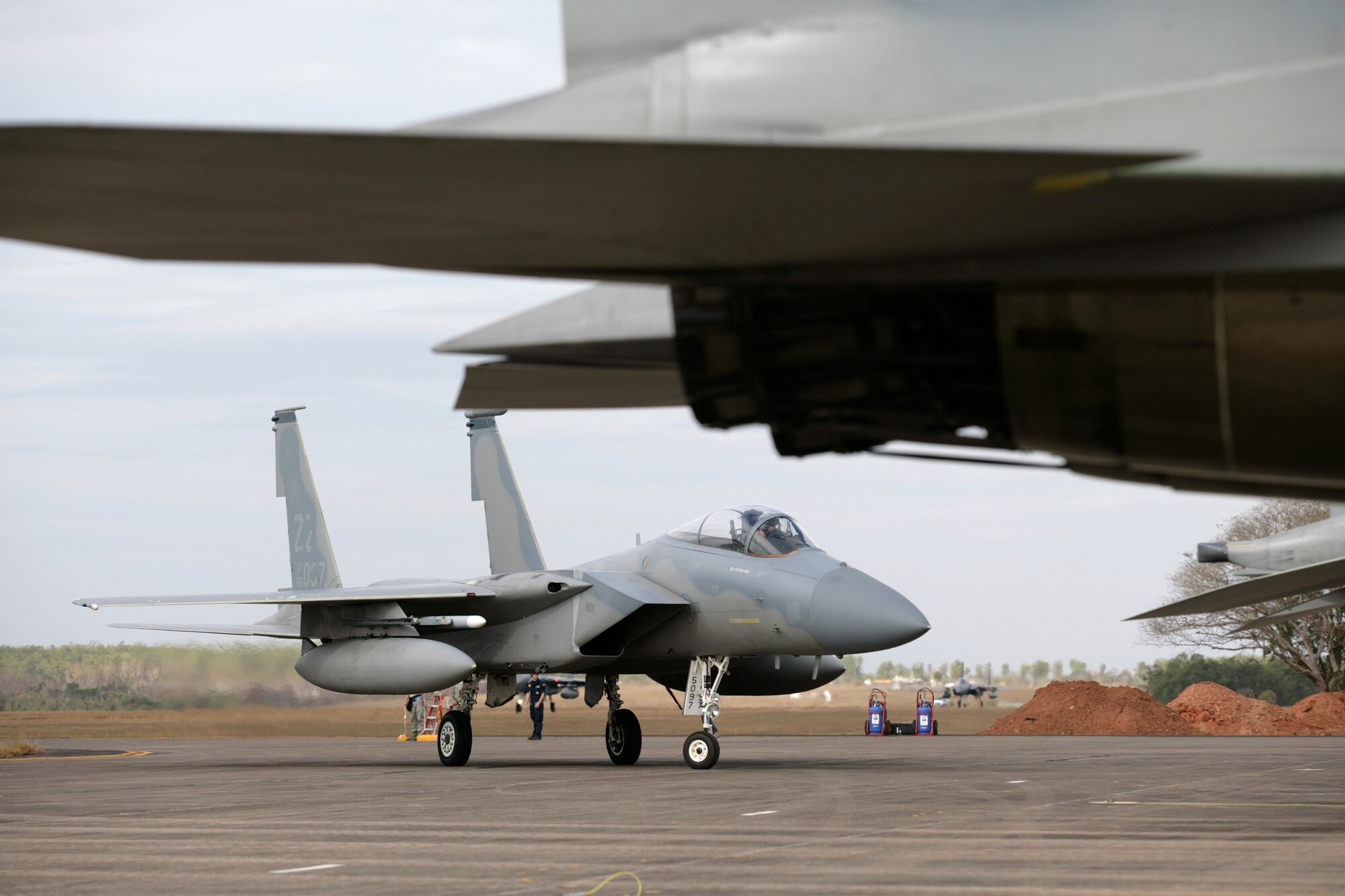 F-15C Eagles from the United States Air Force's 44th Fighter Squadron return from a sortie during the buildup to Exercise Talisman Sabre 2011.Mid Caption: RAAF Base Darwin is hosting six F-15C Eagle fighter jets from the United States Air Force?s 44th Fighter Squadron for Exercise Talisman Sabre 2011. The Eagles, based at Kadena Air Base in Okinawa, Japan, are being supported by technicians from the 18th Maintenance Squadron, also from Kadena. These aircraft are conducting missions over training areas in the Northern Territory with a mix of United States Air Force, Navy, and Royal Australian Air Force aircraft.