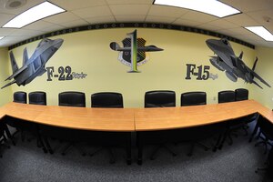 Airmen from the 1st Fighter Wing designed and renovated the Airman Leadership School Eagle flight classroom at Langley Air Force Base, Va., July 15, 2011. The room features a bright new paint scheme, which includes detailed hand-painted representations of the F-22 Raptor and the F-15 Eagle. (U.S. Air Force photo by Airman 1st Class Camilla Griffin/Released)
