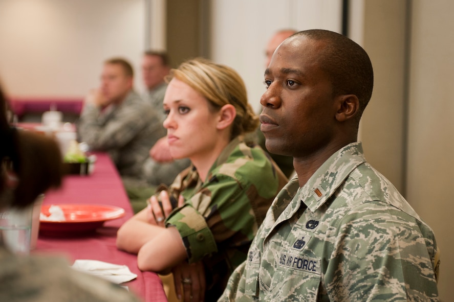 U.S. Air Force 2nd Lt. Paul Pierre, 23rd Logistics Readiness Squadron vehicle management flight commander, listens in during lunch with Col. Gary Henderson, 23rd Wing commander, at Moody Air Force Base, Ga., July 13, 2011. Pierre said it was nice hear stories of Henderson’s experiences as a young officer and how it relates to him. He also said he gained knowledge on the direction the Air Force was taking and was able to pass it to Airmen at his shop. (U.S. Air Force photo by Staff Sgt. Jamal D. Sutter/Released)